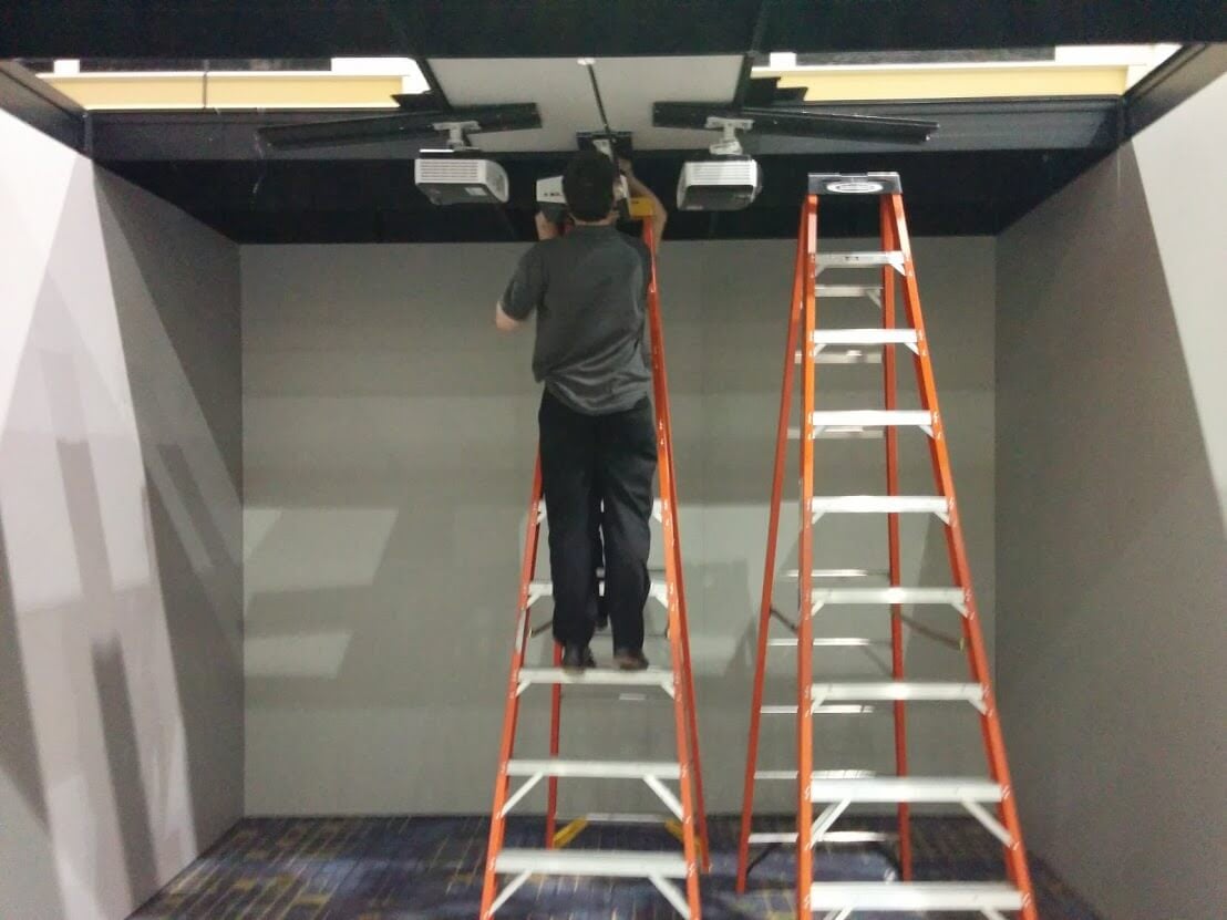 ... AND INSTALL OUR PROJECTORS