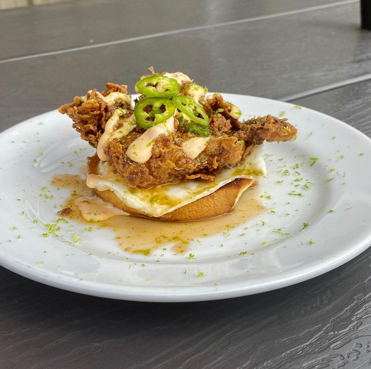 Threw together a little breakfast for the BOH BH brewery crew this am with a few of the items we had in the kitchen. 🤔

Buttermilk fried chicken smothered in jalape&ntilde;o and lime maple syrup, a drizzle of Nashville aioli, and garnished with fres