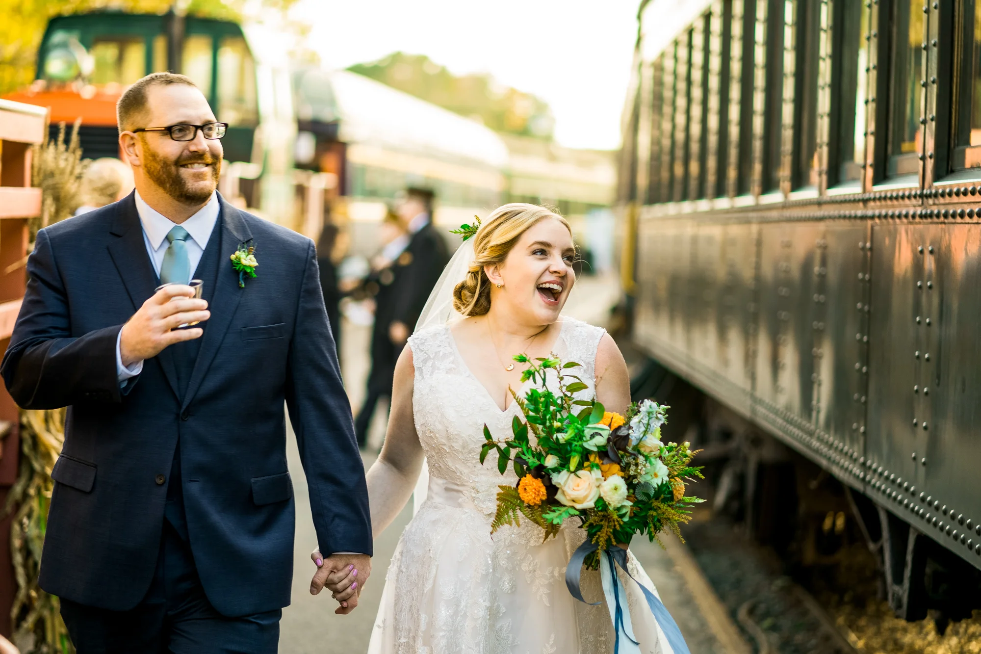2018 Number 7 | Alex & Pat | Essex Steam Train & The Lace Factory Sony a9 | 85 f1.8 As a young couple, Alex and Pat have been through alot. Perhaps, more hardship than most ever will. But here they are, on their wedding day, about to board a steam train, drinks and flowers in hand, with 200 of the most important people in their lives cheering them on. No couple of mine could understand more the importance of finding small moments of joy in life, and immersing yourself in them. It was an honor to photograph this wedding.