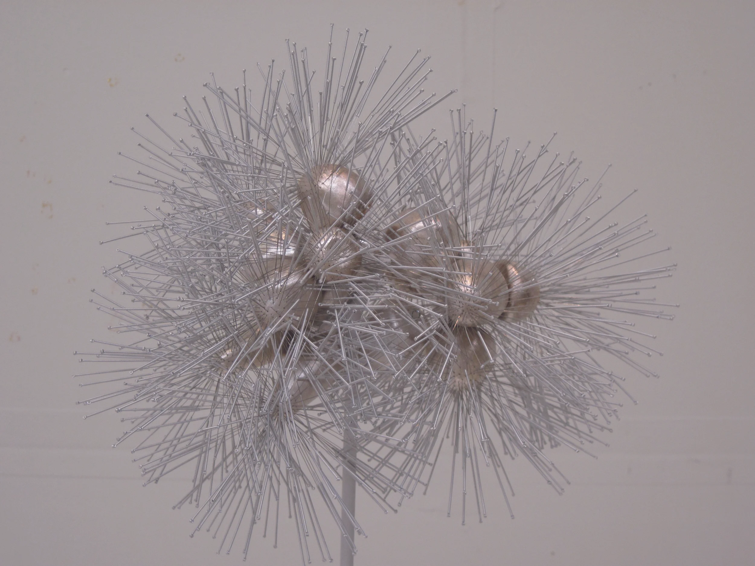 Born , 2010, acupuncture needles, mixed media, private collection