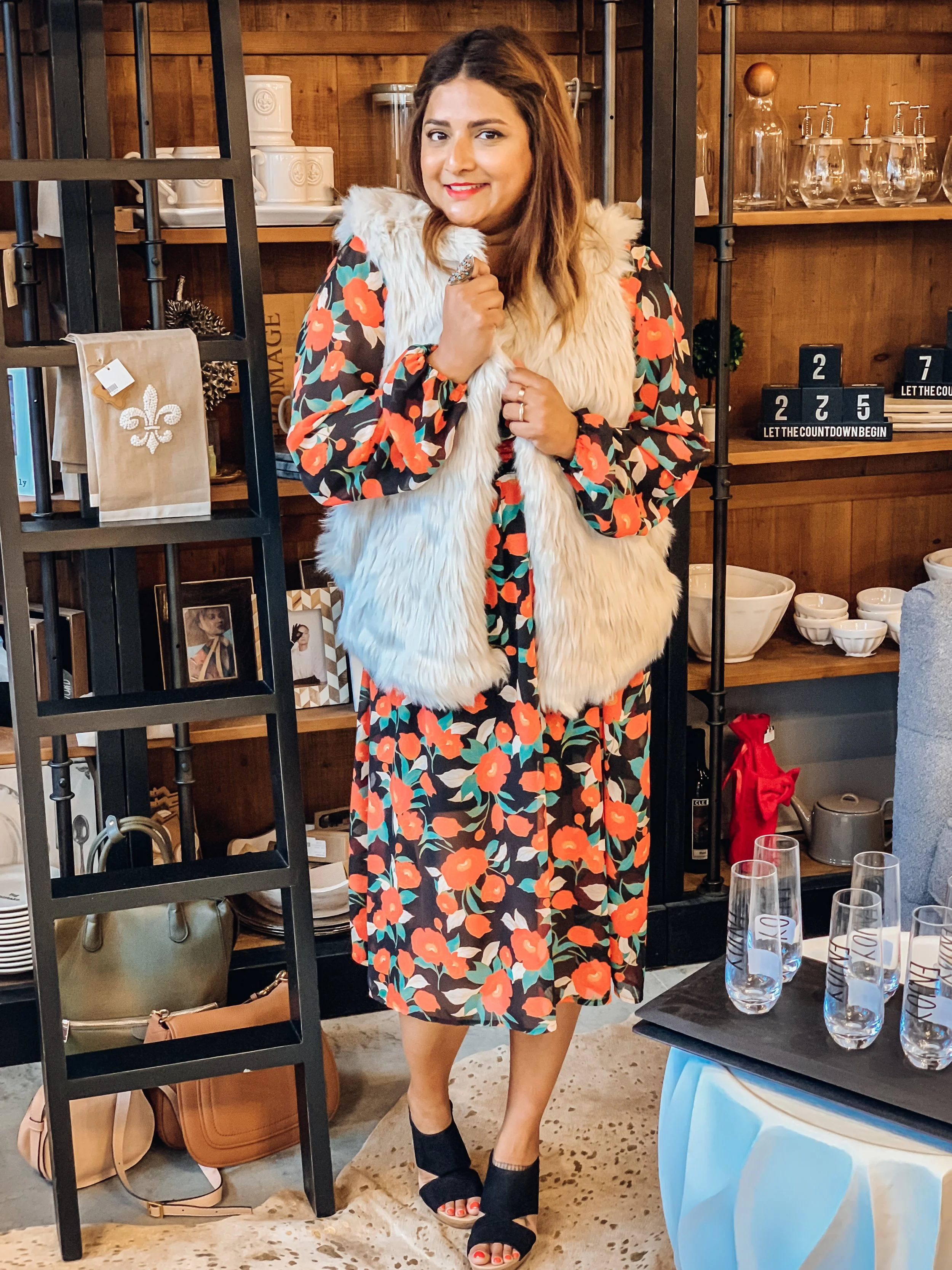 As night time temperatures start to drop, I love dark florals paired with faux fur vests for a cozy look. This vest is Dylan Los Angeles, available at Laura of Pembroke at Pinecrest. As of this writing, this vest retails for $155