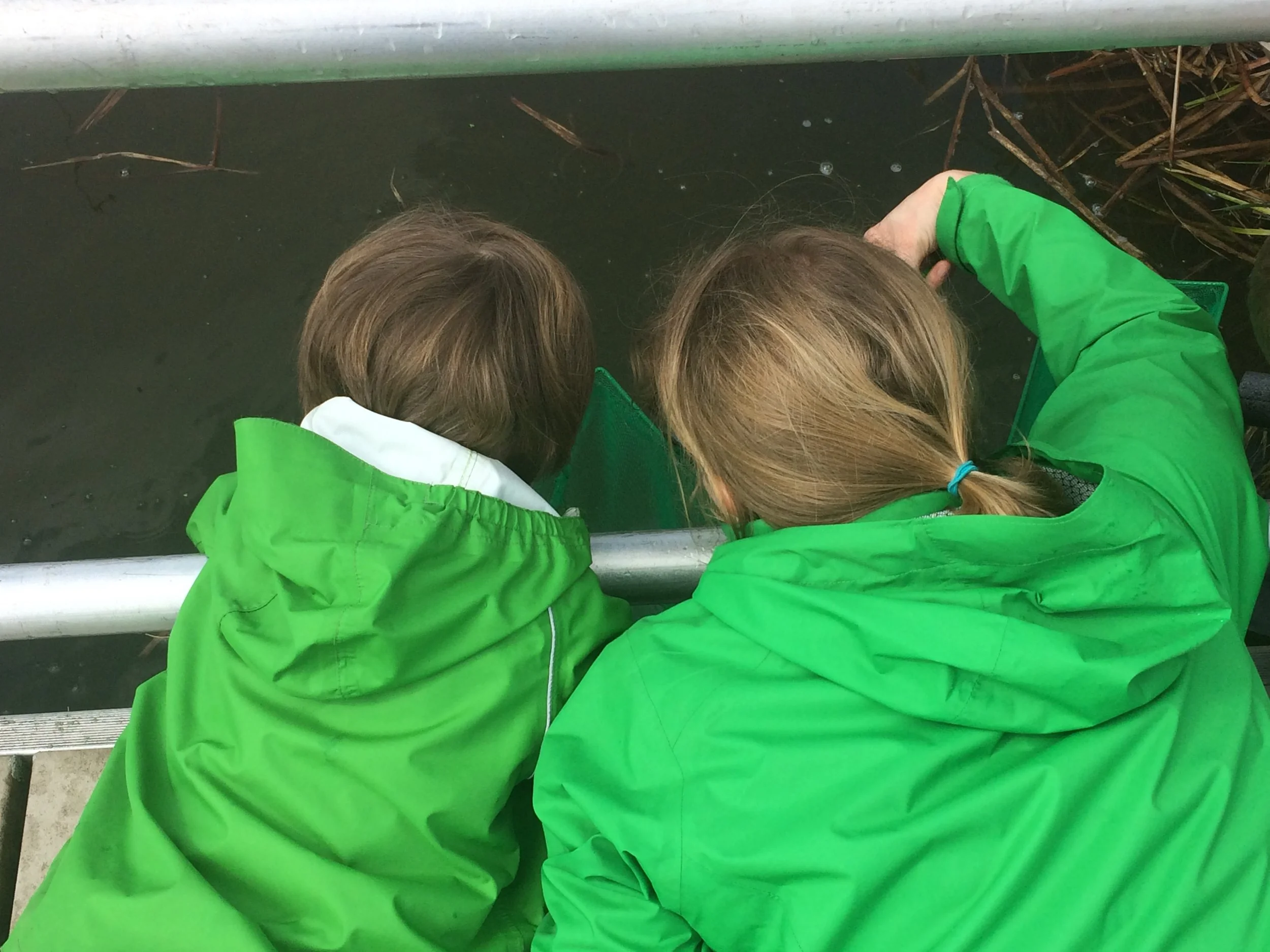 Teacher and child by pond.JPG