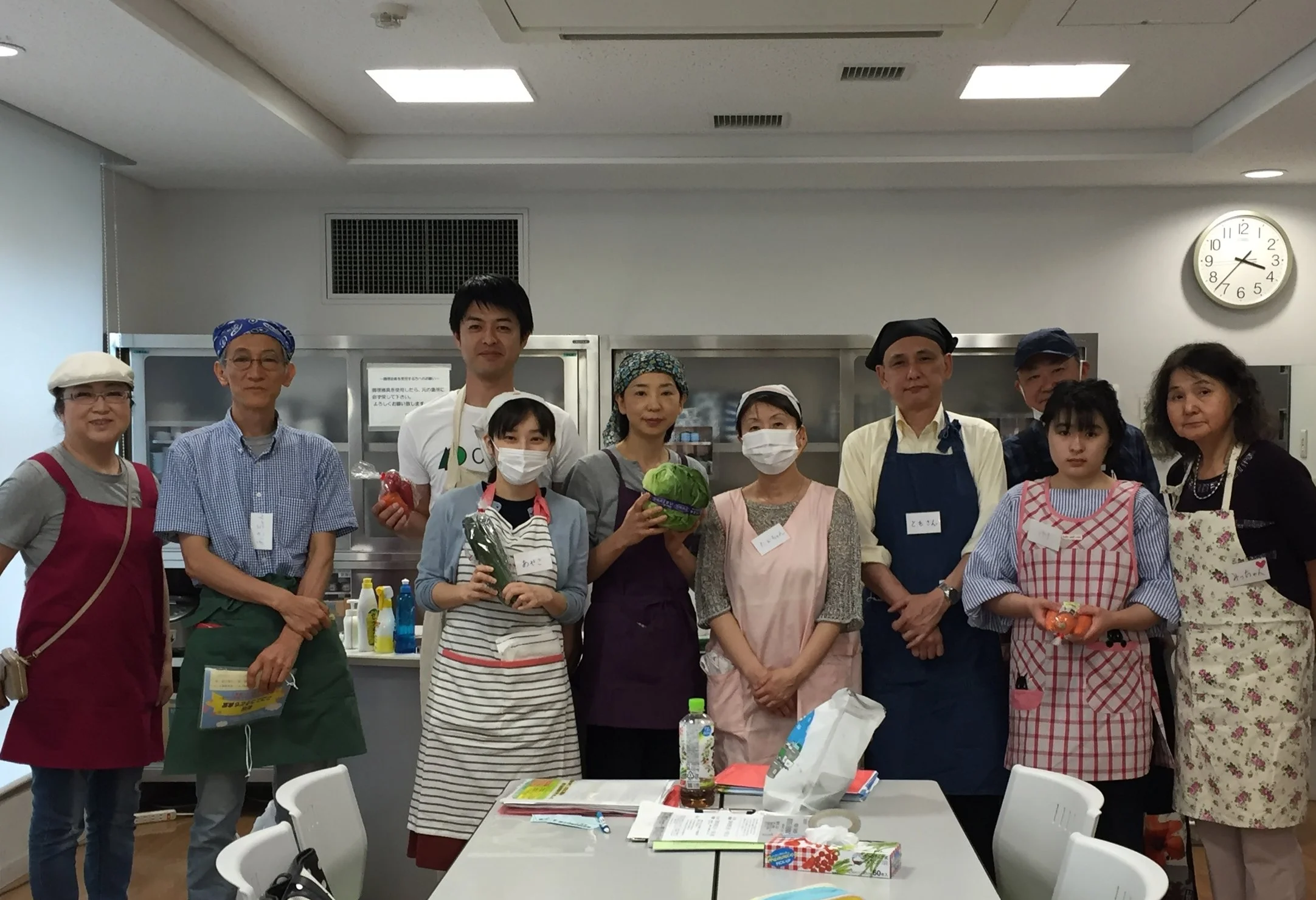 Members of PaperSeed japan alongside other volunteers making dinner with the charity "Children's Dinner" for PaperSeed Day 2017