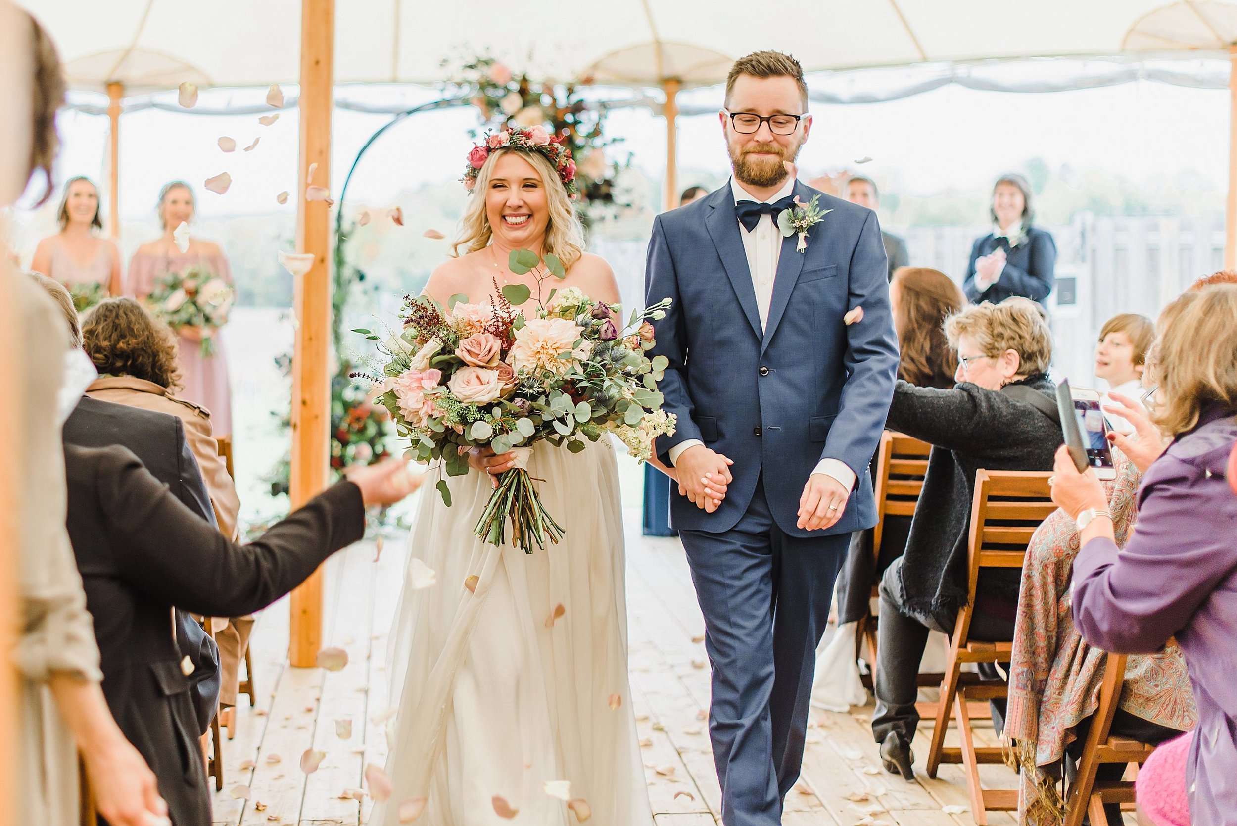  The flower girls forgot to lay the flower petals for their processional, so we made due by having guests sprinkle them in the air during the recessional instead!  I think it worked out wonderfully! 