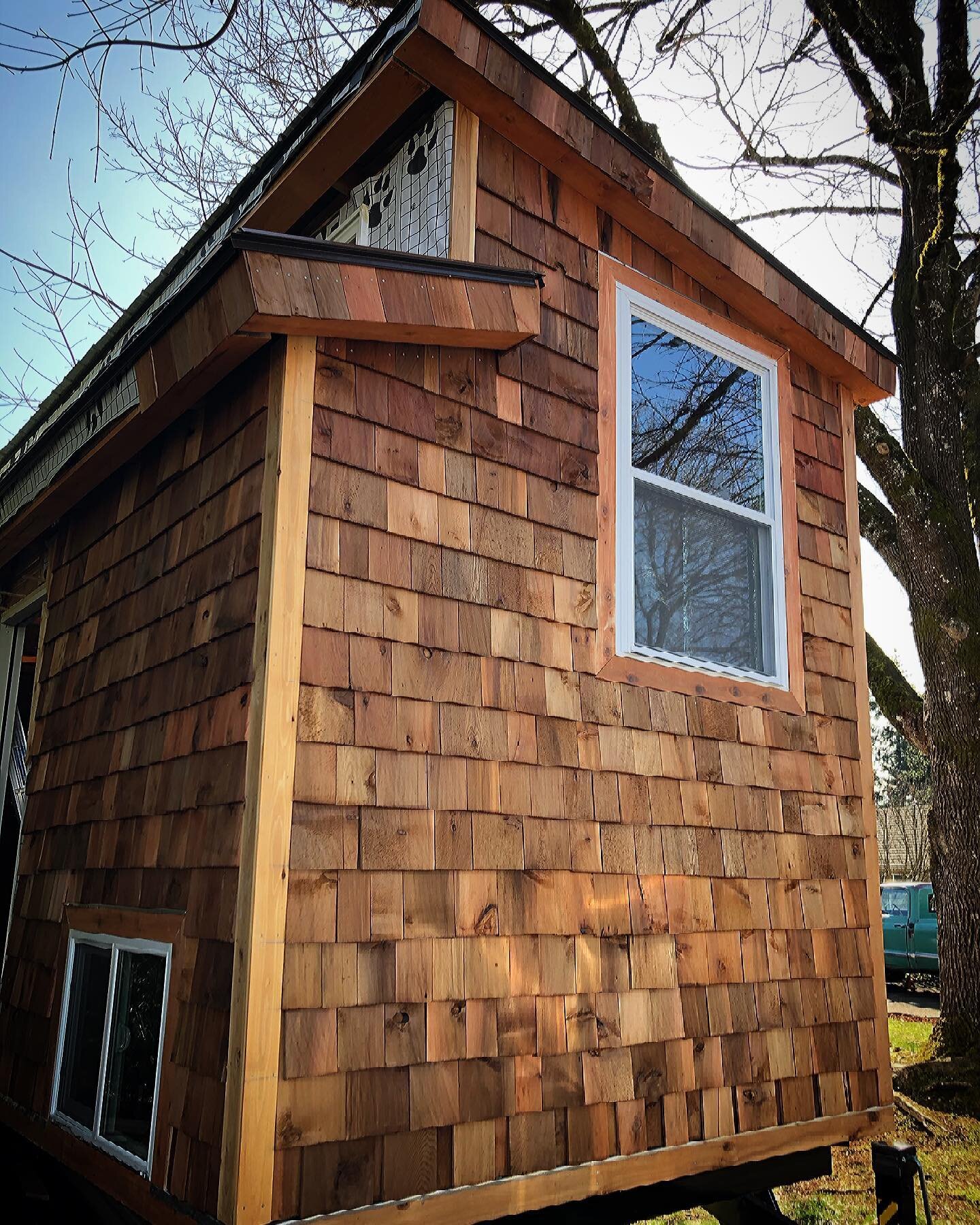 We made big progress on this beautiful day. One side is complete. Two windows are complete! 

#tinyhouse #tinyhome #cedarshakes #diy #buildyourownhome