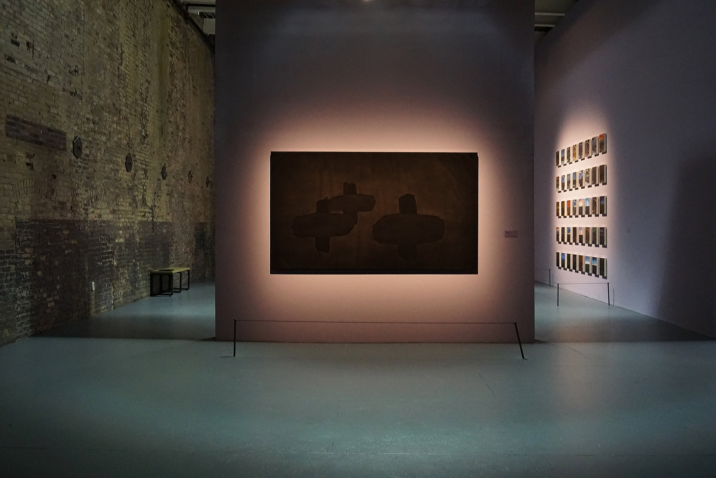   The Veils are Thin,  2019 Black gesso on canvas 93 x 53 inches (2.36m x 1.34m)  Installation view in  The Lure of the Dark: Contemporary Painters Conjure the Night at Mass MoCA  