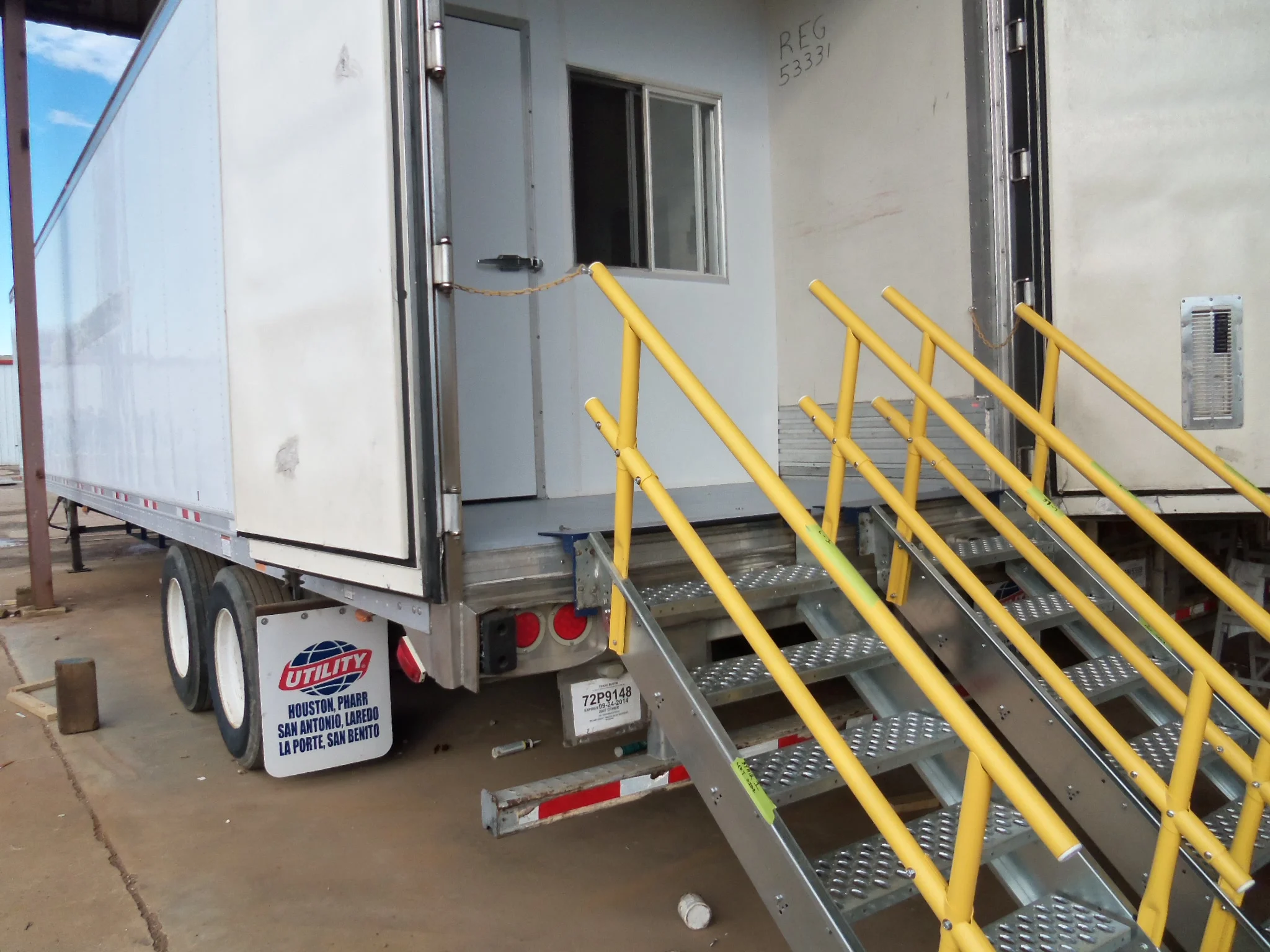 Temporary stairs may be stowed under the trailer when in transit.