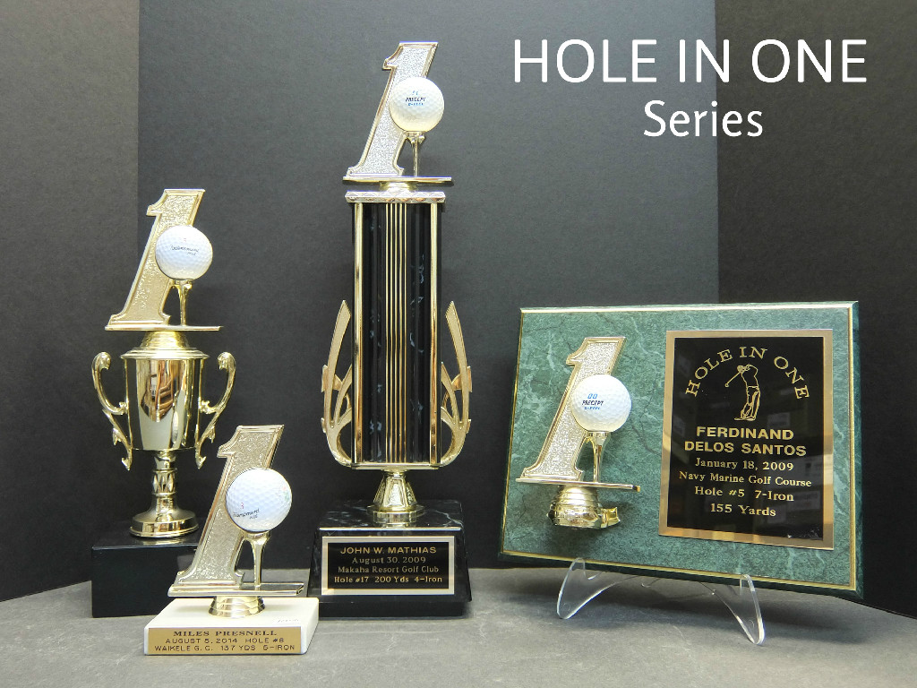 HOLE IN ONE CUP - 32.00, SMALL HOLE IN ONE 10.50, HOLE IN ONE TROPHY - 44.00, HOLE IN ONE PLAQUE - 54.00