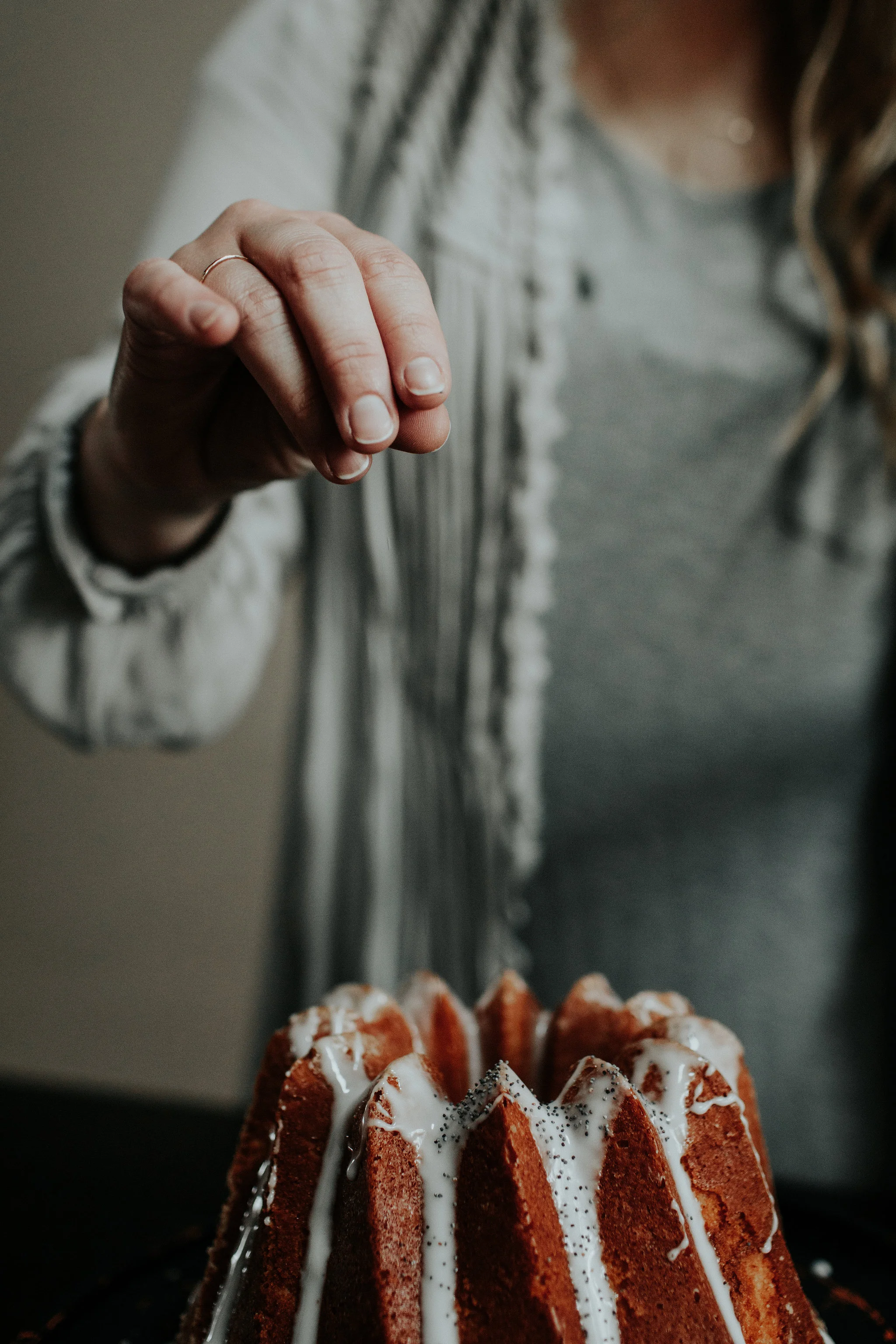 vanilla bean cake + honey whiskey glaze, garnished with poppy seeds.