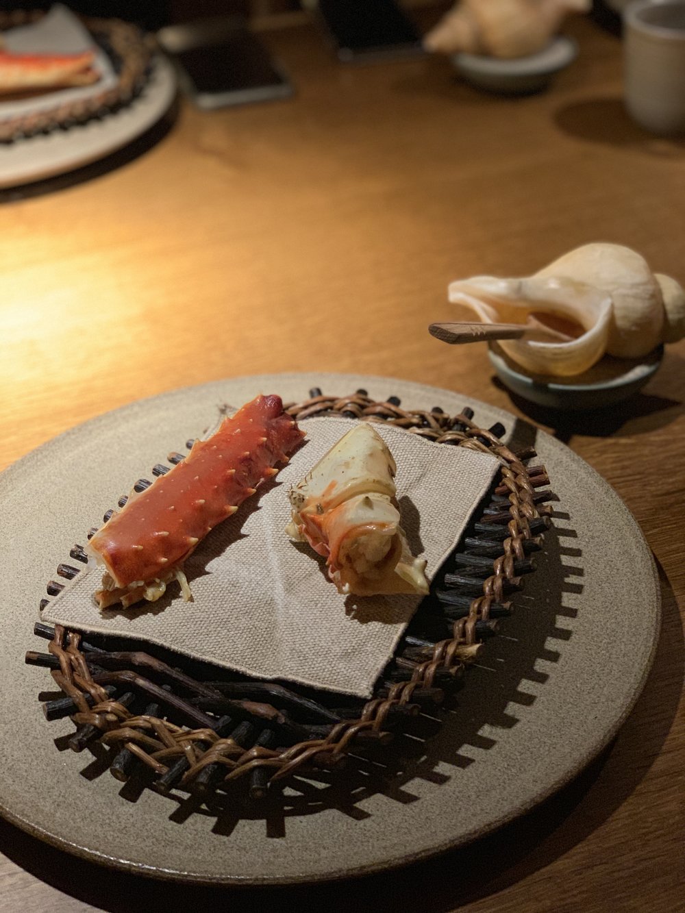  King crab from Norway. Kept alive at Noma until cooked. Hot smoked, then barbecued and seasoned with a sauce of sonicated horseradish (displayed inside a lovely shell). 