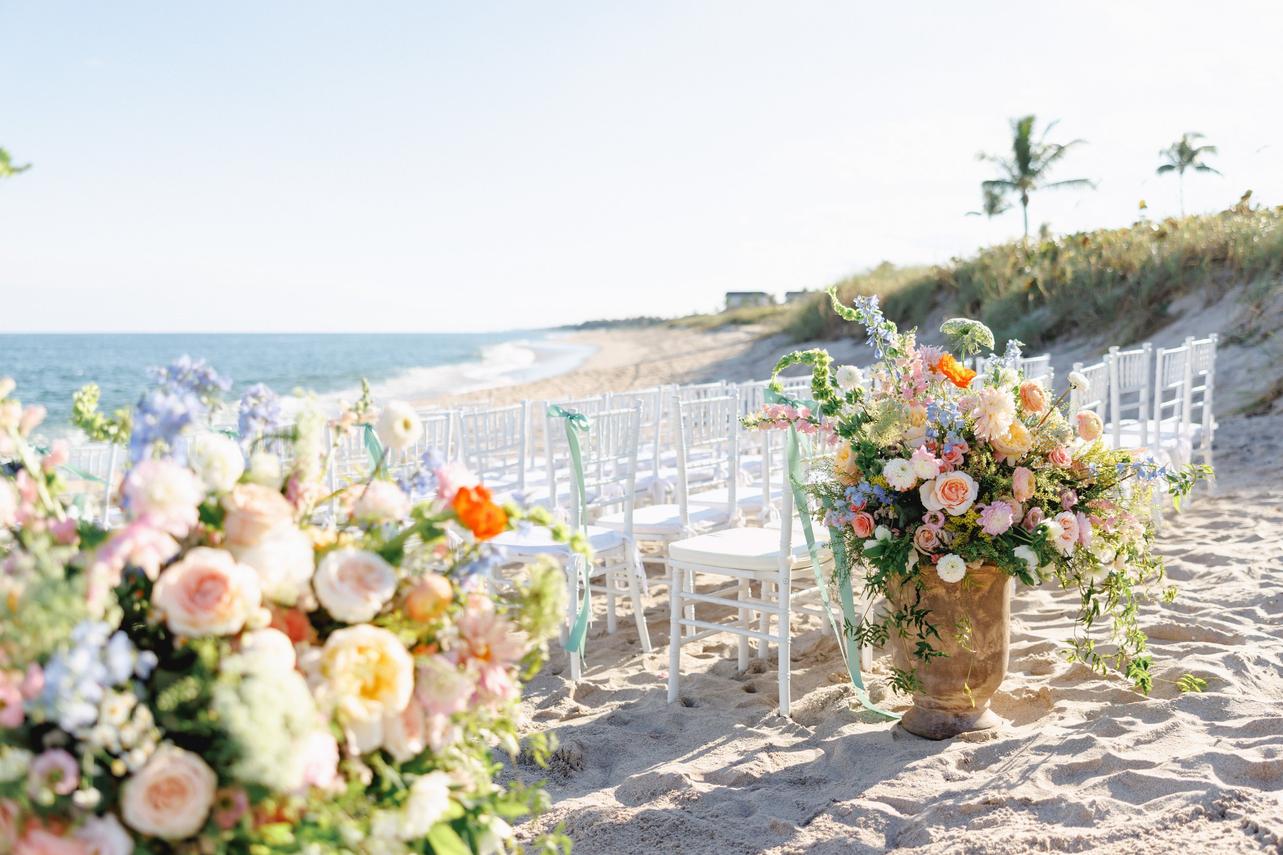 lush overflowing ceremony flowers in peach and yellow.
