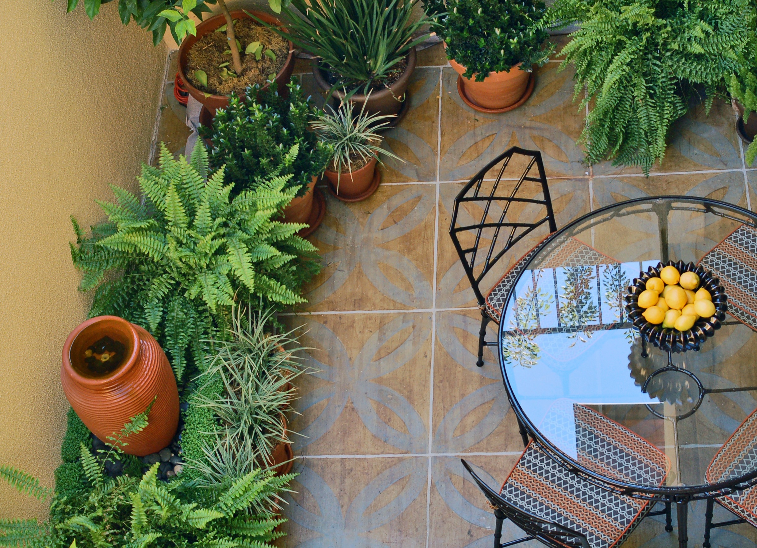 Painting a plain concrete pad with stain tranforms the space.