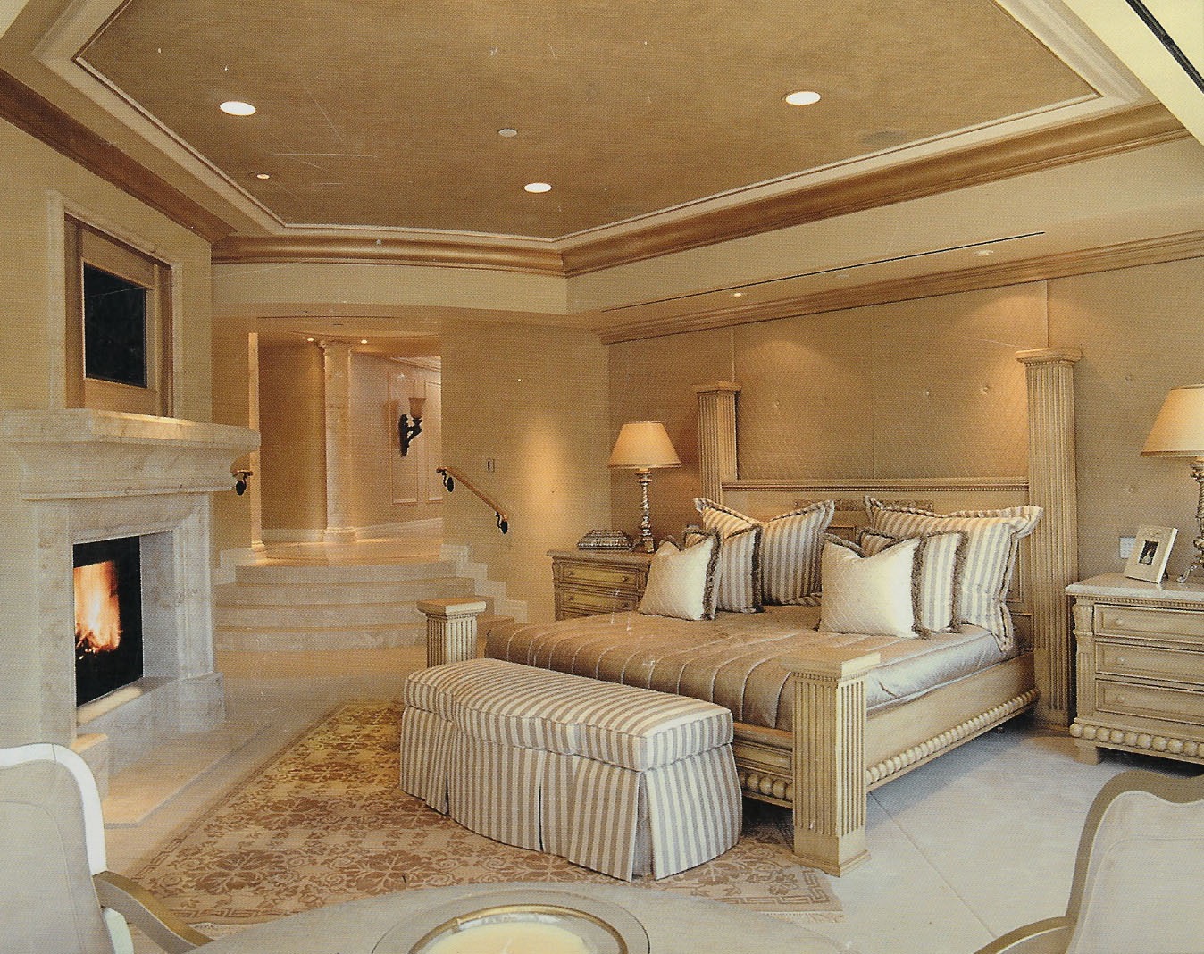 The walls and ceiling are stippled and the crown molding has been silver leafed.