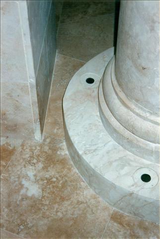 The column is marble but the contractors forgot the uplighting so plaster bases were created to accommodate them. I painted those bases to match the column above.