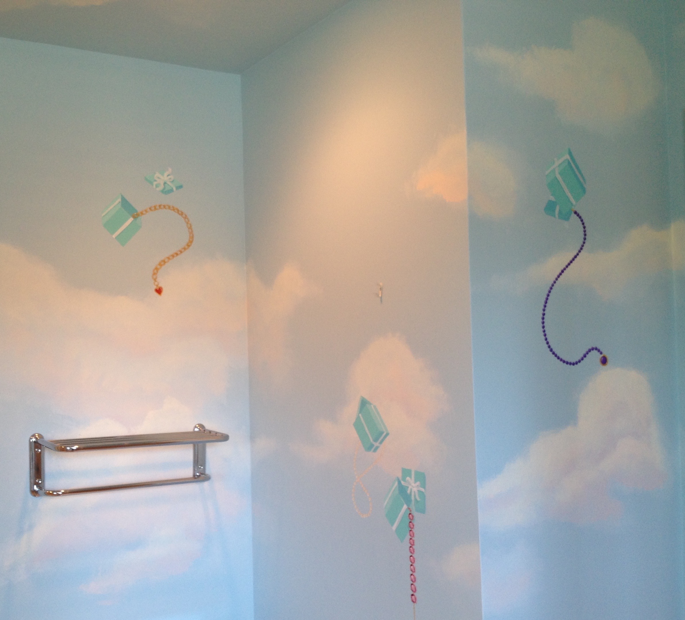 The Tiffany bathroom is an unexpected joy. Jewels spill from the iconic blue boxes raining down from the heavens.
