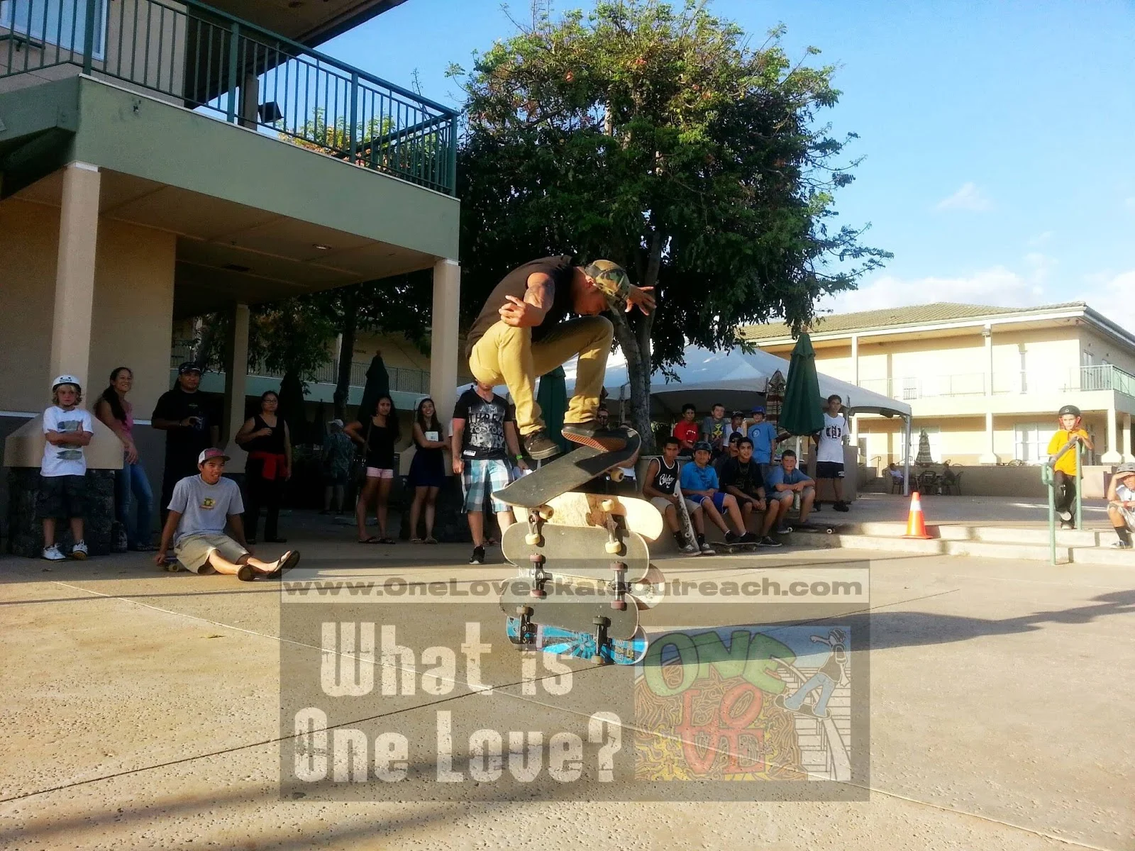 Sam Peralta ollie at a #OneLoveSkate event w/Josh Knipple being a supportive "butt head." :) Full Story Here: http://oneloveskateoutreach.blogspot.com/2013/06/one-love-skate-vertical.html