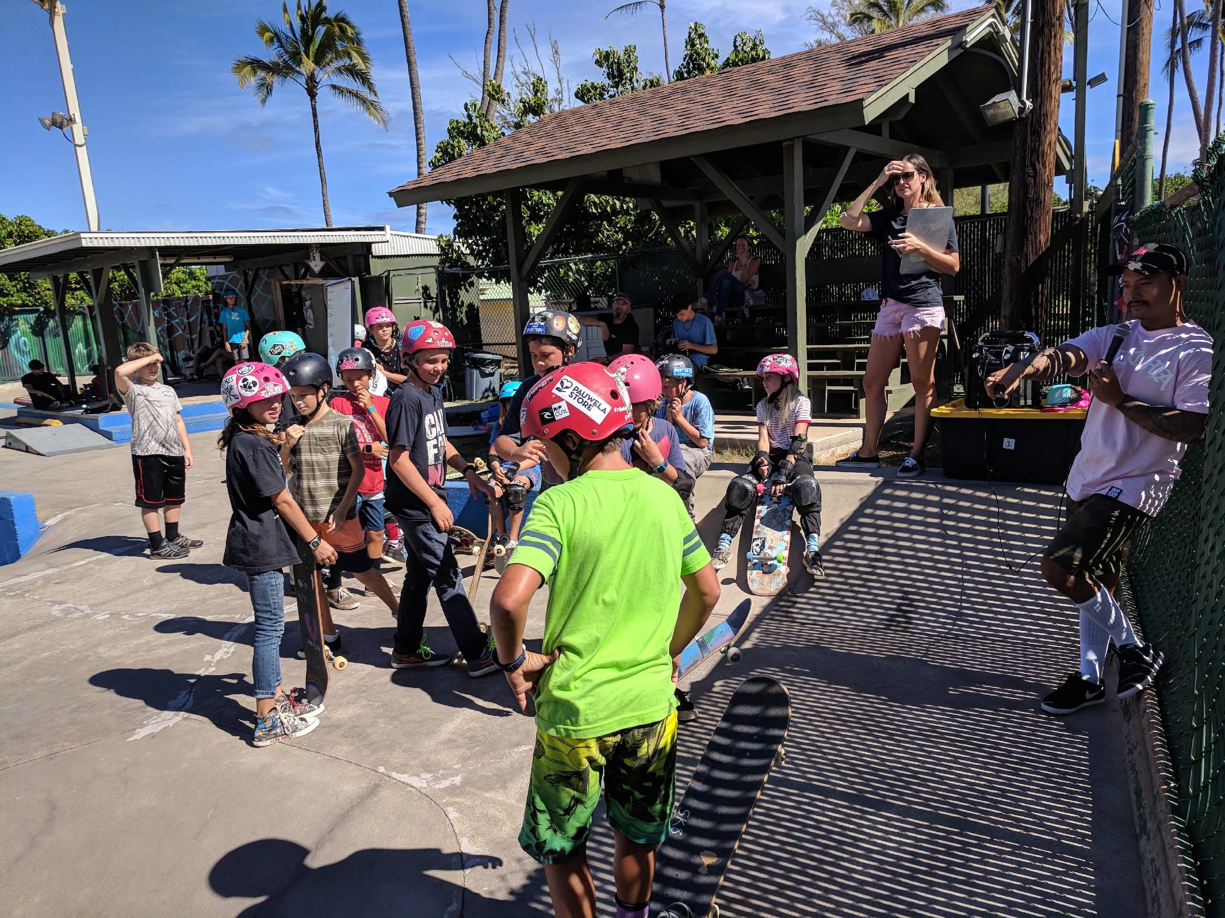 Sam of One Love, & Lo from Paia Youth & Cultural Center, pictured here bringing the fun & keeping track of points as students played "Simons Says, Skate!"
