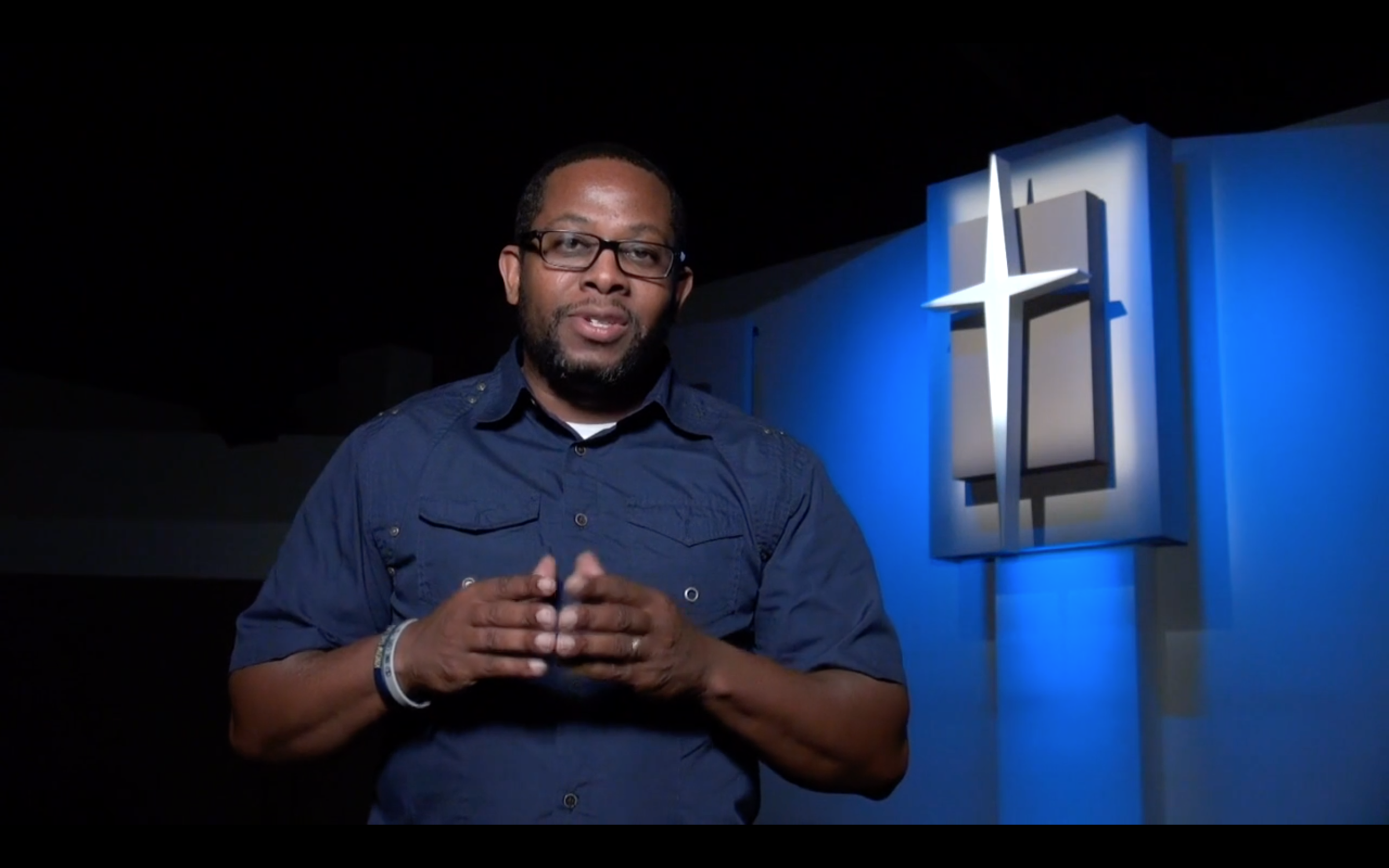 Rodney repping a 1L Wrist Band in the new Pleasant City Church Invite Video
