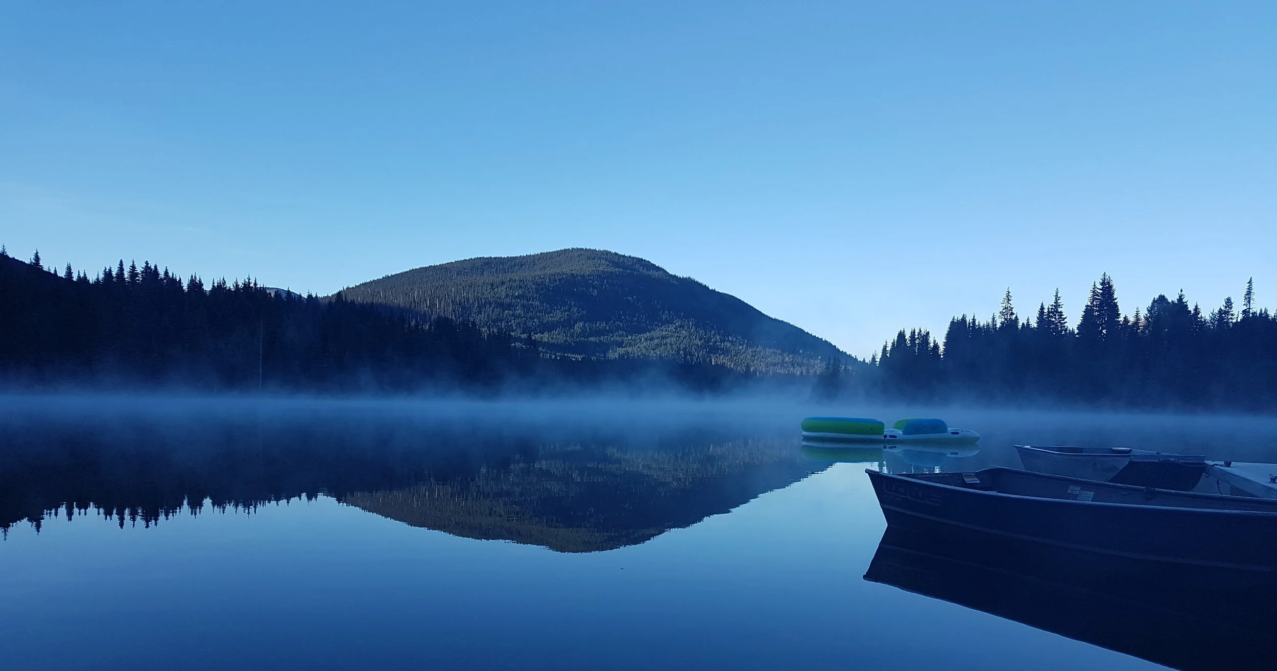Mist rising from the lake at Coquihalla Lake Lodge just before sunrise