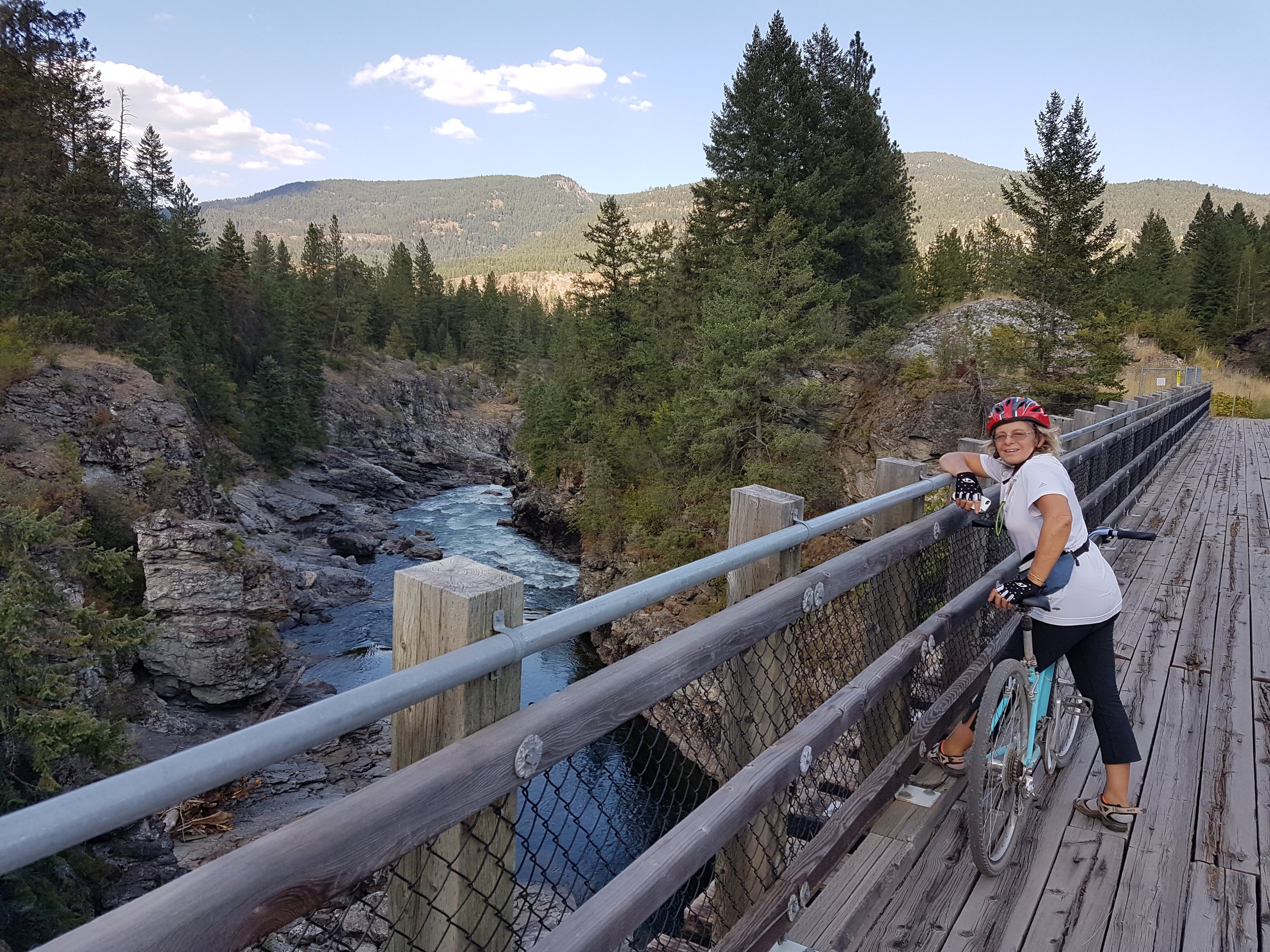 Crosing the Kettle River on the Columbia and Western Rail Trail during one of our Multiday bike tours