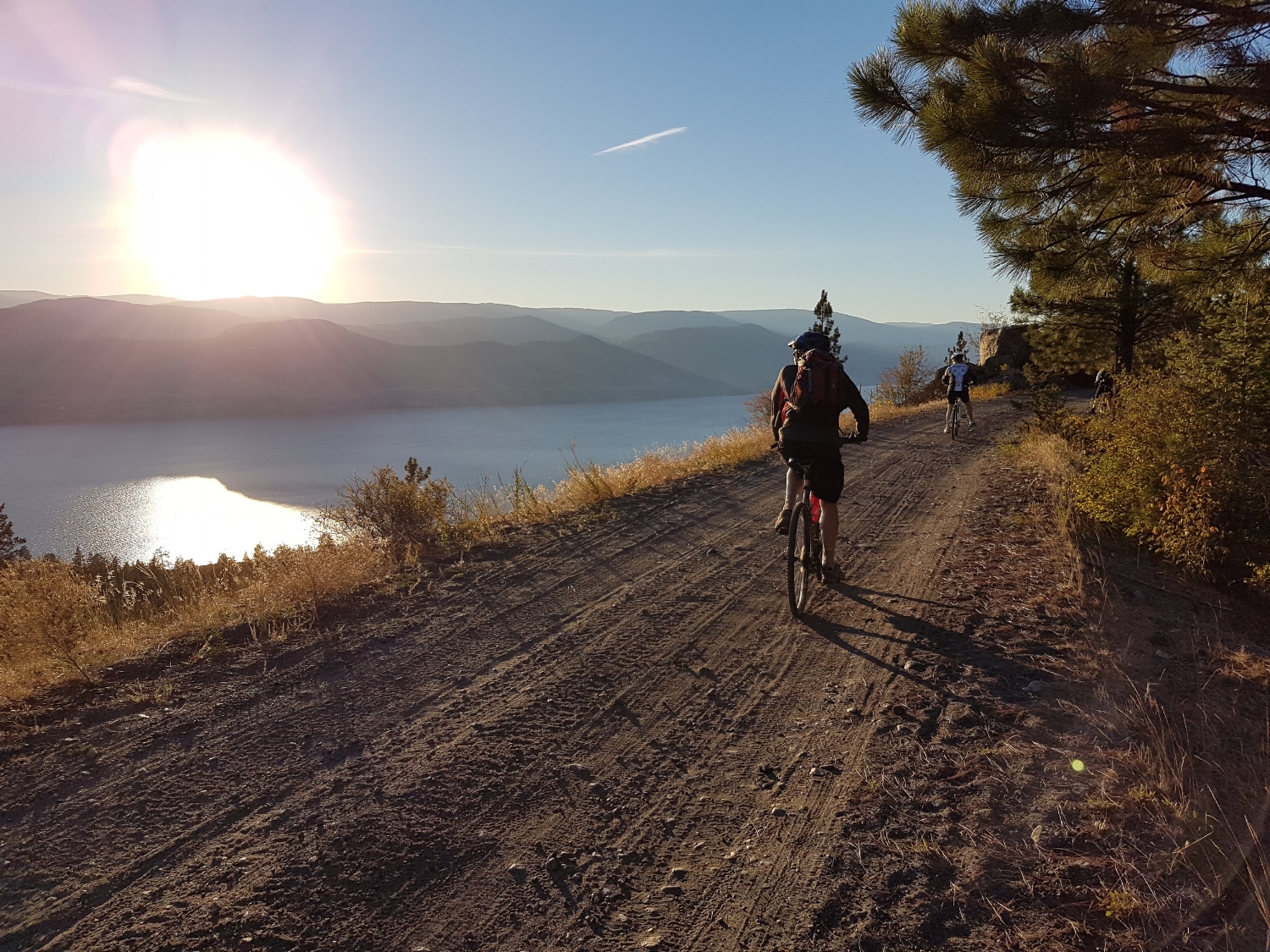 Bike touring along the Okanagan lake on the KVR trail