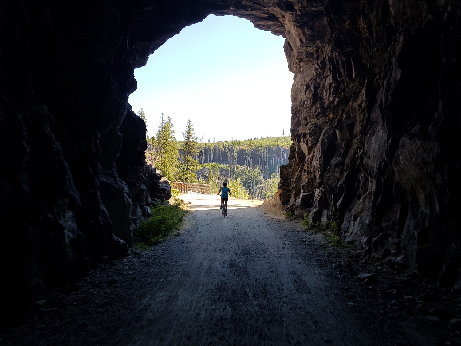 Cycling in the Tunnels at Myra Canyon on the KVR trail on our multiday bike and hike tour