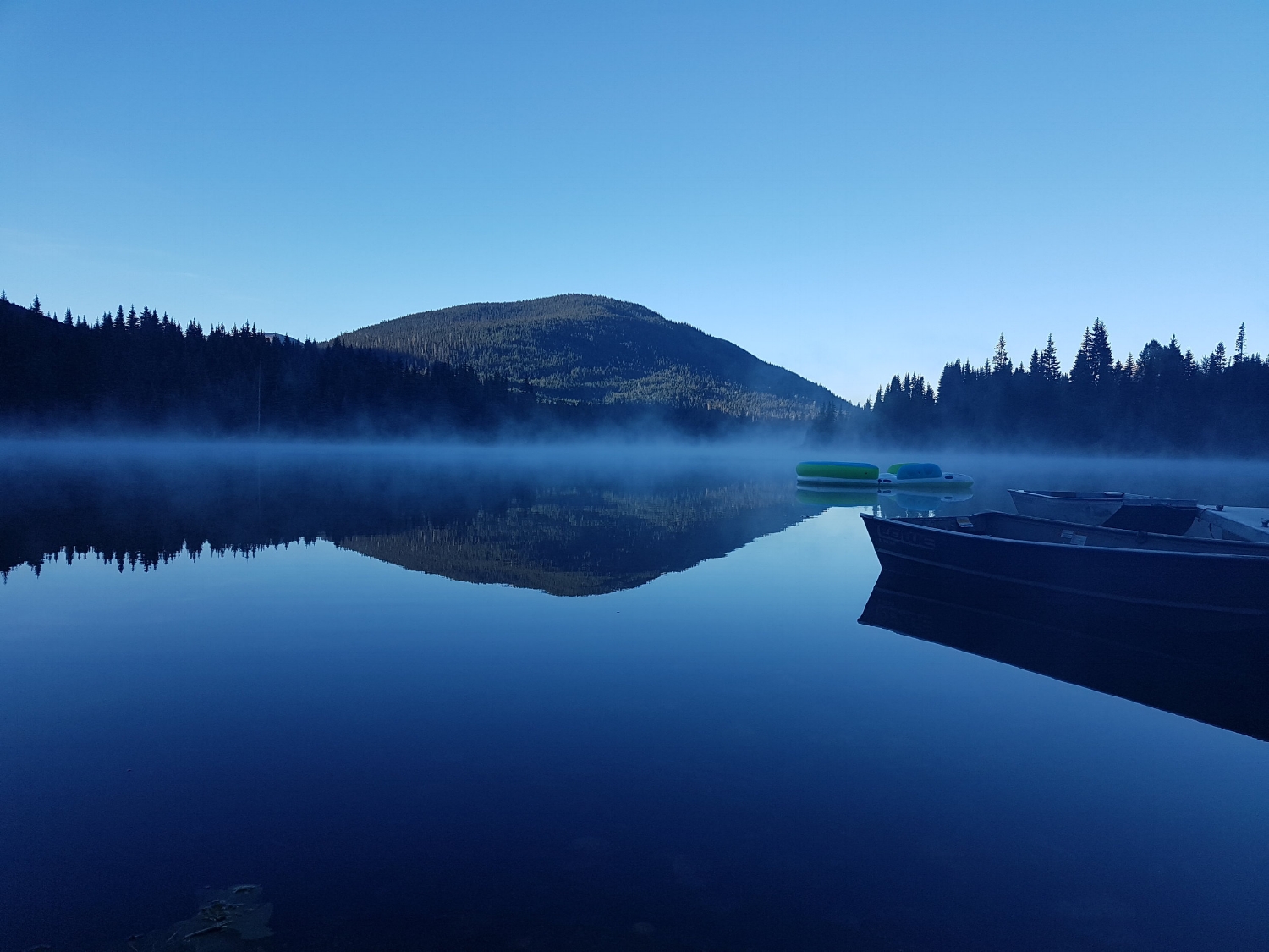 Mist rising above a lake during our Multiday bike and hike trip