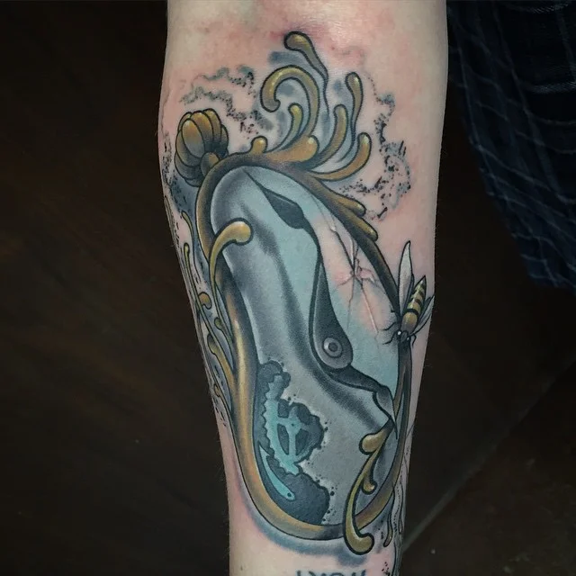 Melted watch tattoo