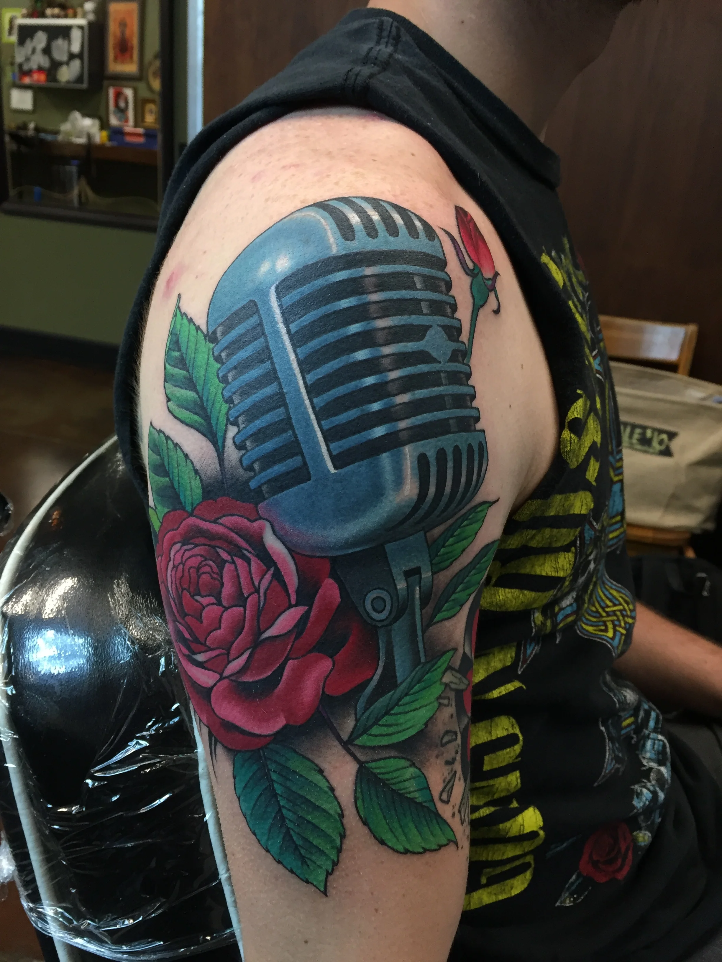 Microphone and rose tattoo