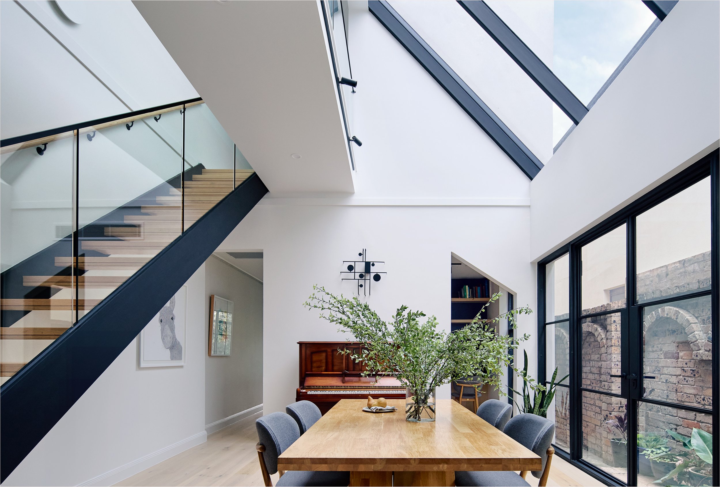 Stargazer - Queens Park NSW  An intervention to an existing home, with a glass roof and stairwell as a focal point.   Photography: Andreas Bommert 