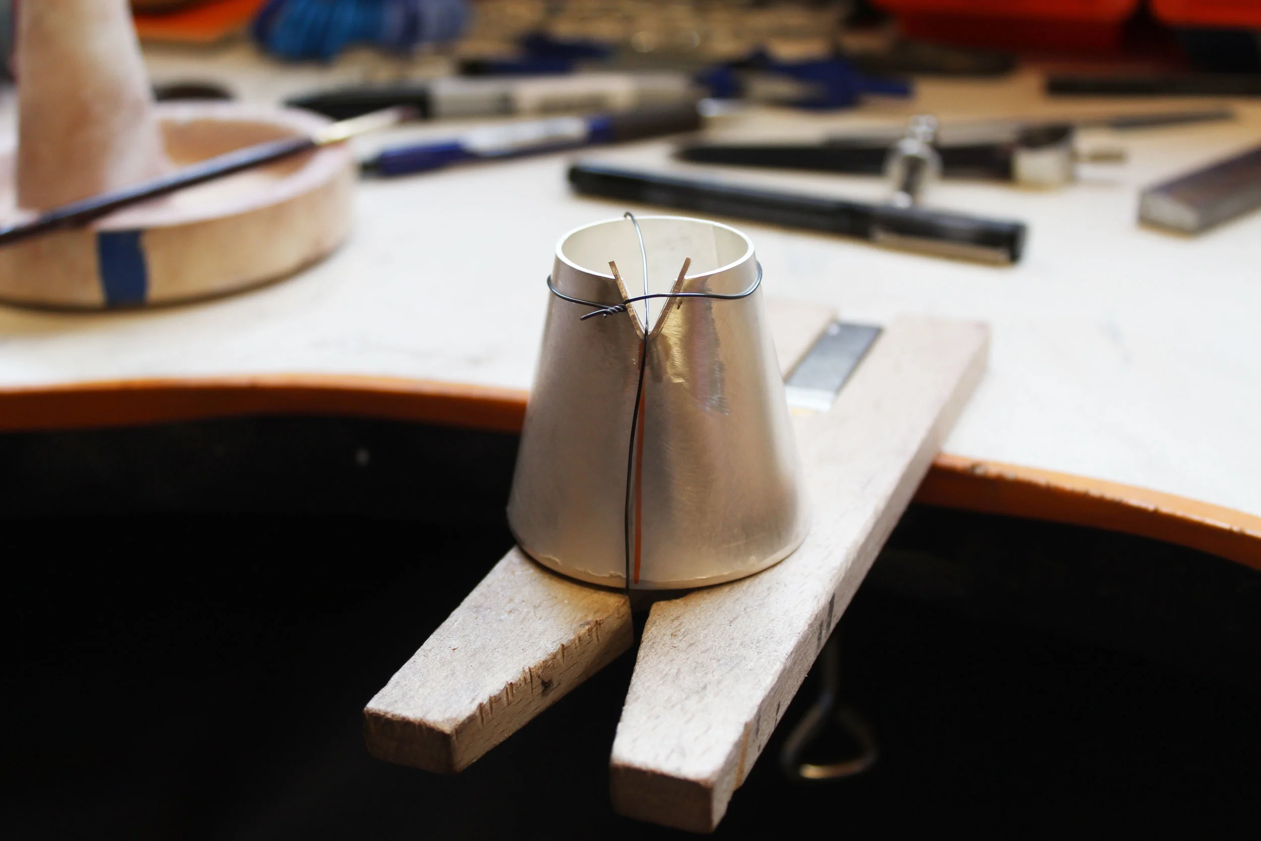 Spout held in place with binding wire ahead of being soldered