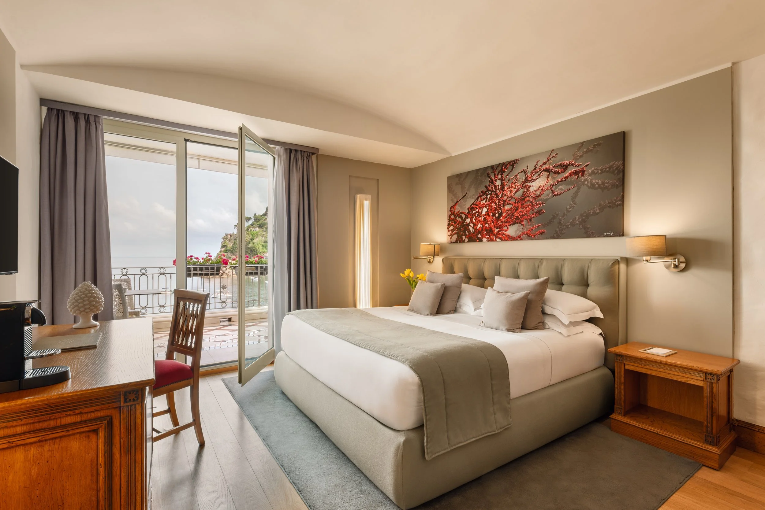 Boutique hotel suite bedroom with sea view and arched ceiling, interior photography by David McConaghy