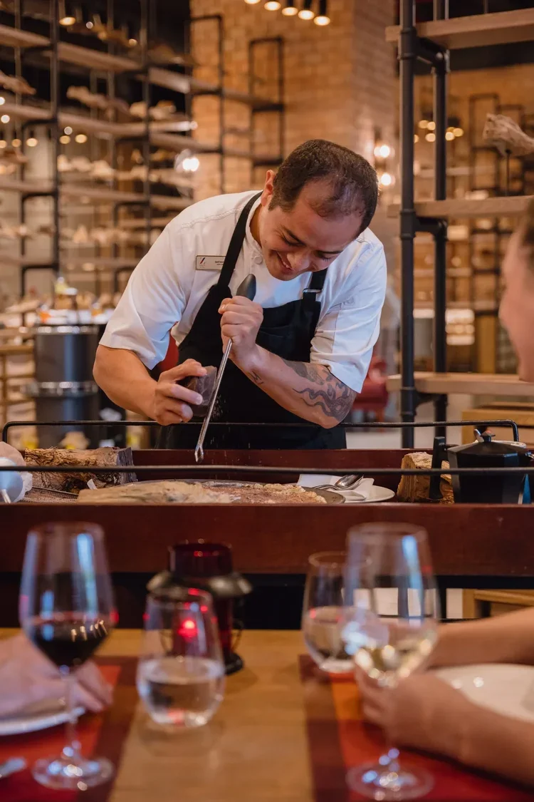 Hotel chef preparing food at restaurant grill, staff photography by David McConaghy

