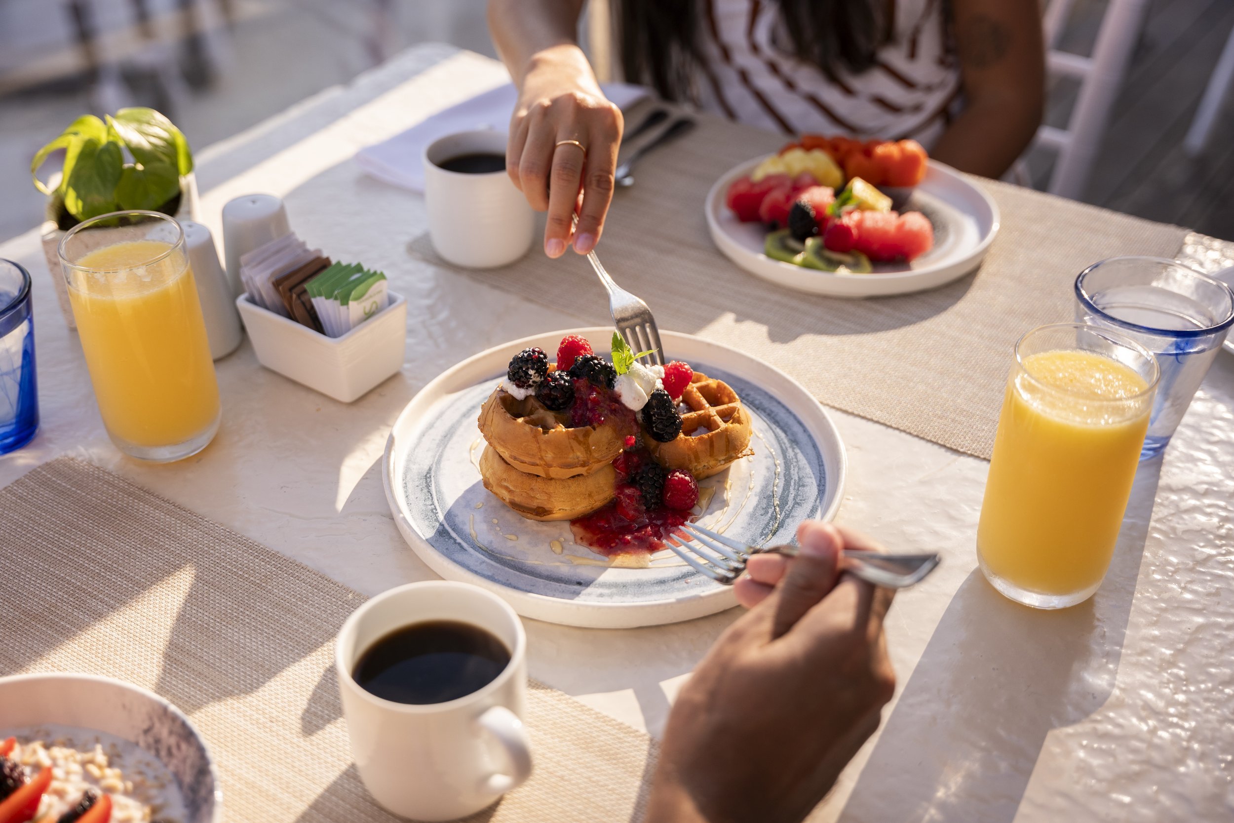 Hotel breakfast with pancakes and fresh fruit, food and beverage photography by David McConaghy