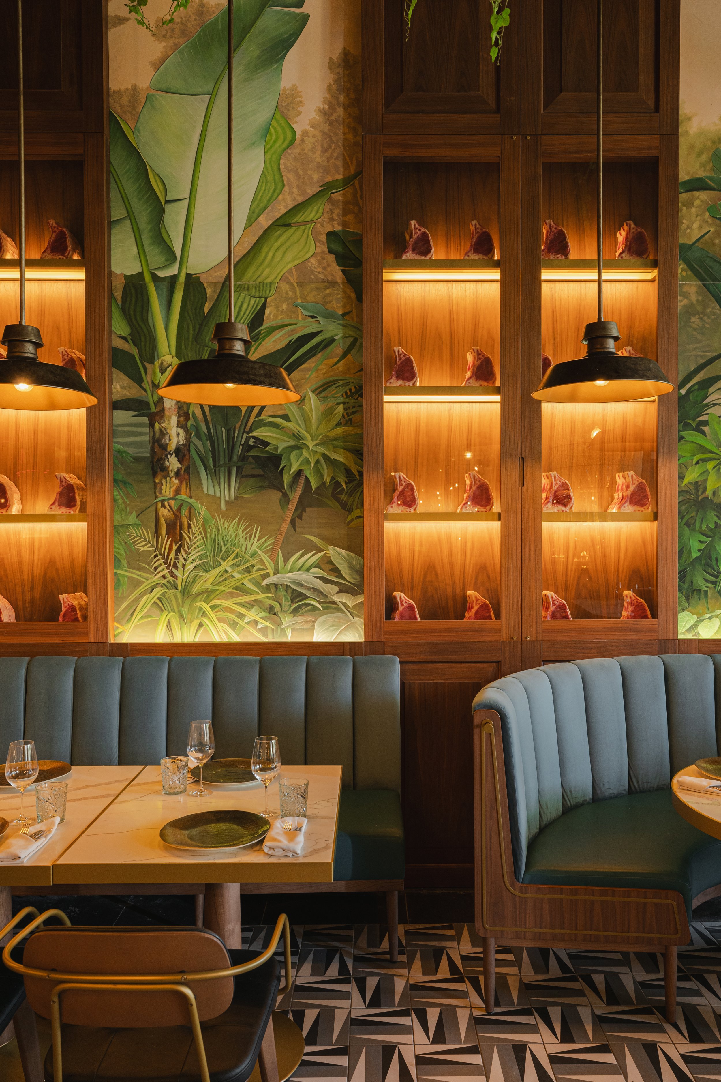 Intimate hotel bar and dining area with warm lighting and tropical decor, David McConaghy Photography

