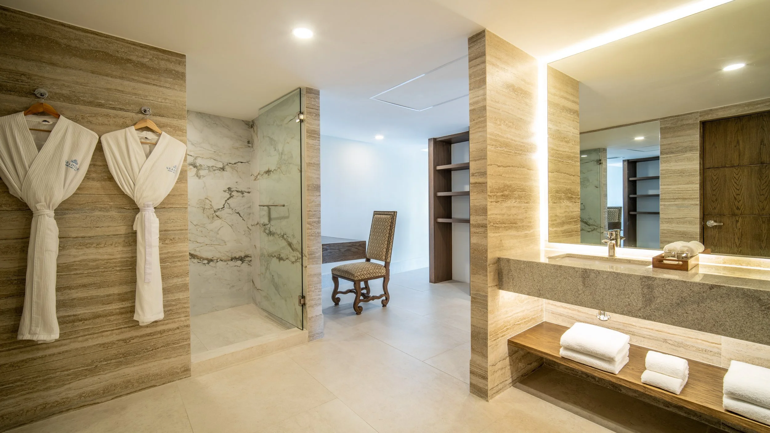 Luxury hotel spa bathroom with marble finishes and mood lighting, interior photography by David McConaghy
