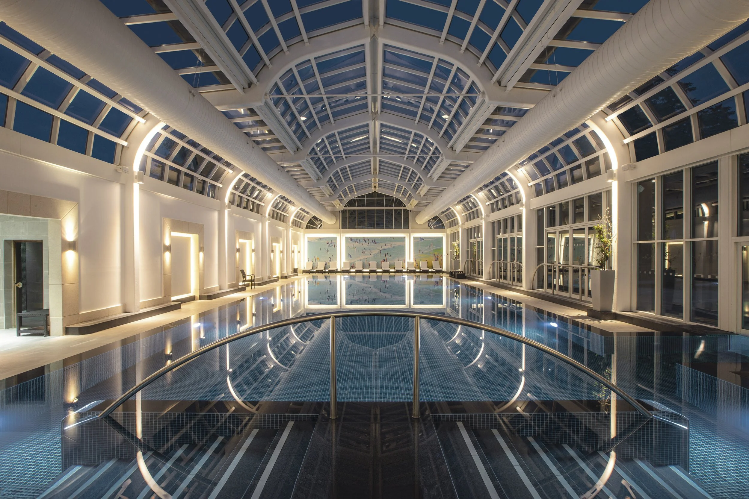 Luxury hotel indoor swimming pool with ornate glass ceiling, interior photography by David McConaghy