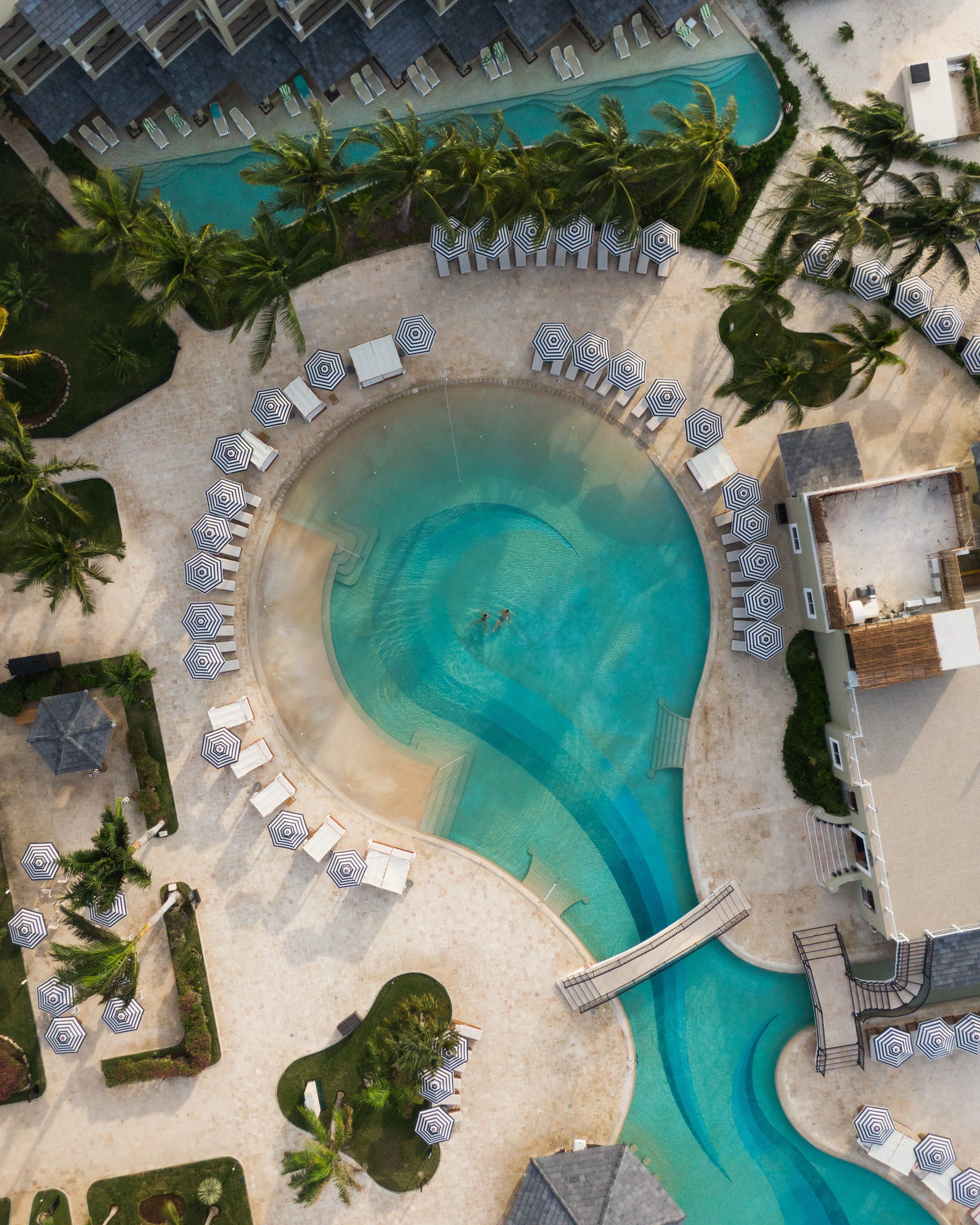 Aerial view of luxury resort pool and sun terrace, hotel photography by David McConaghy