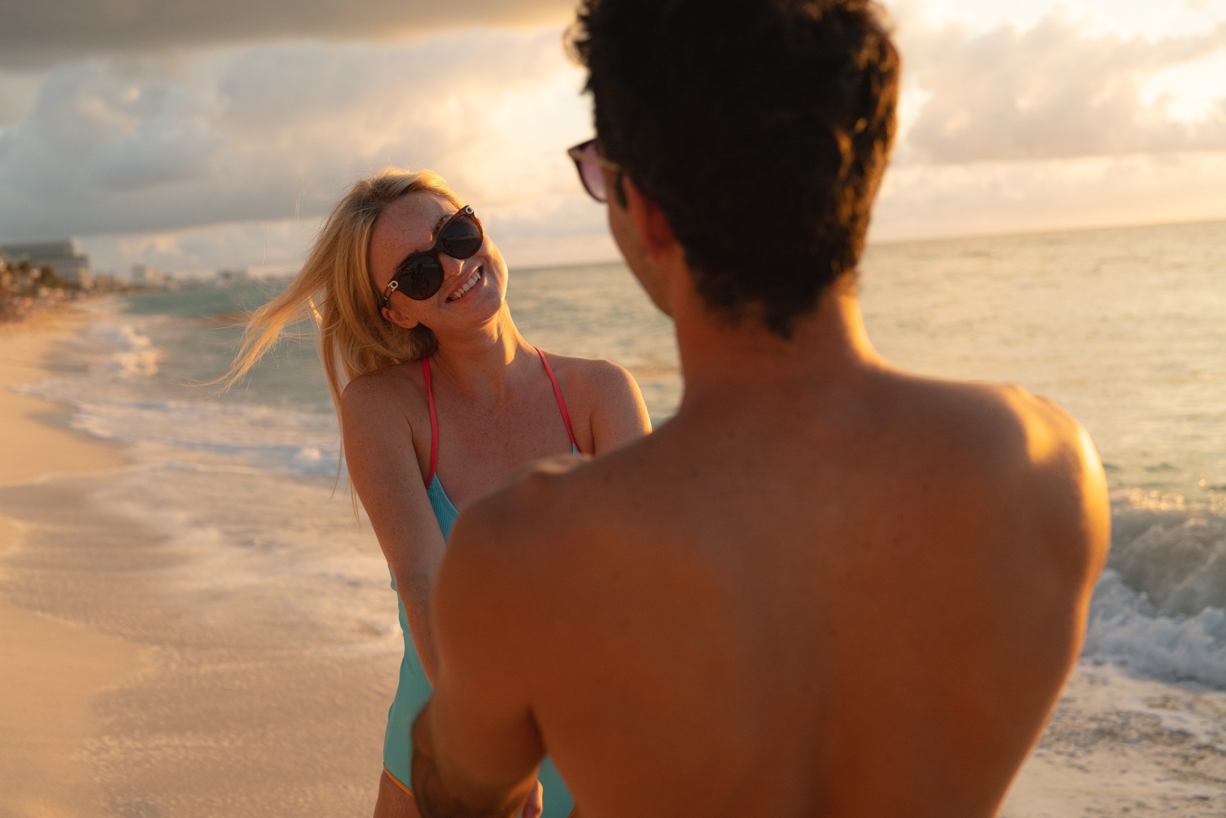 Couple at sunset on the beach at luxury resort, lifestyle hotel photography by David McConaghy