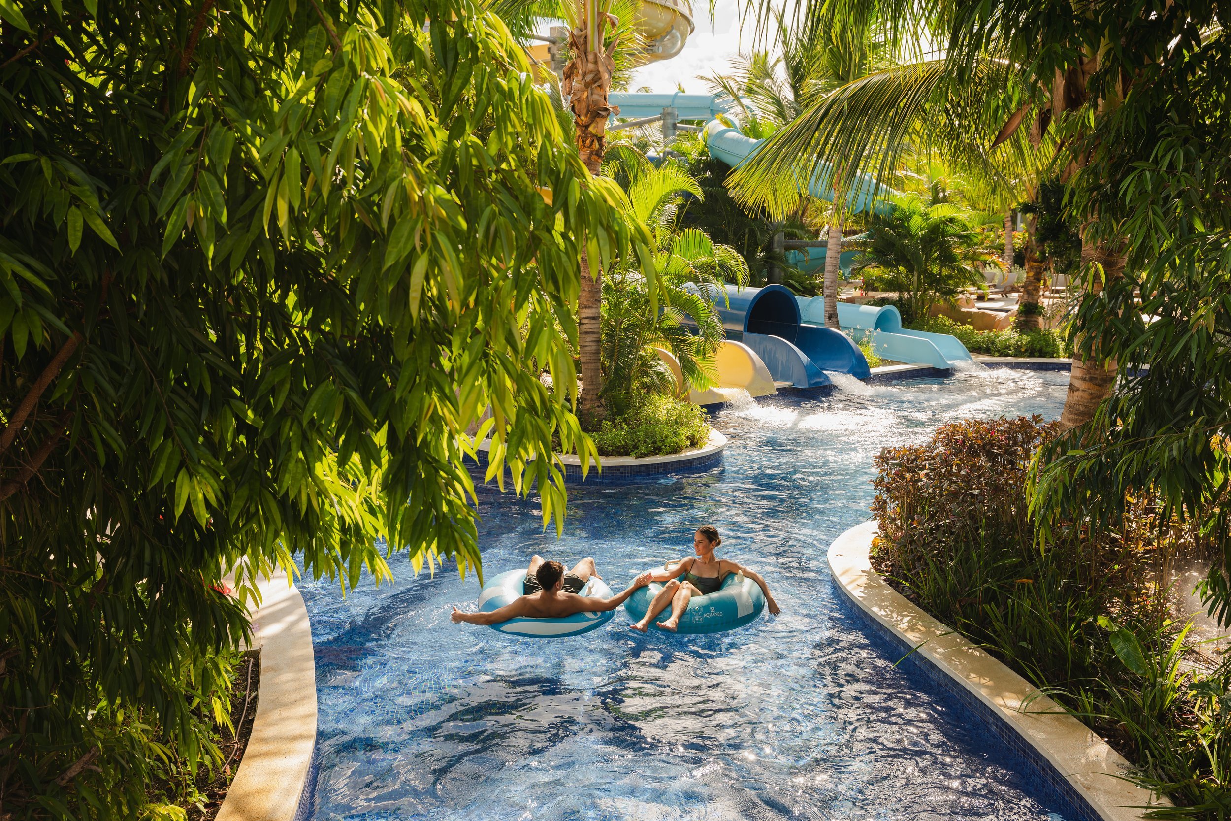 Hotel guests enjoying lazy river pool at luxury Caribbean resort, photography by David McConaghy