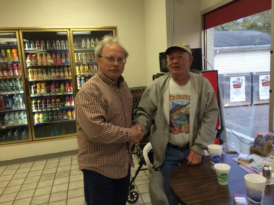 The Honorable Gregory J. Donat shaking hands with a voter on Election Day in 2014.