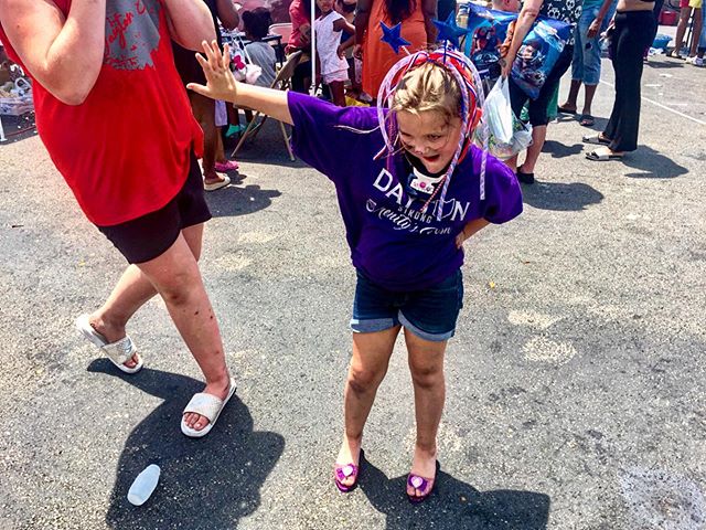 July 14, 2019, Dayton, OH&mdash;Serenity, whose neck is in a brace following brain surgery last year, dances in a pair of borrowed heels at a Dayton tornado relief station off Main Street. She, along with her mother, Caitlin, have organized this even