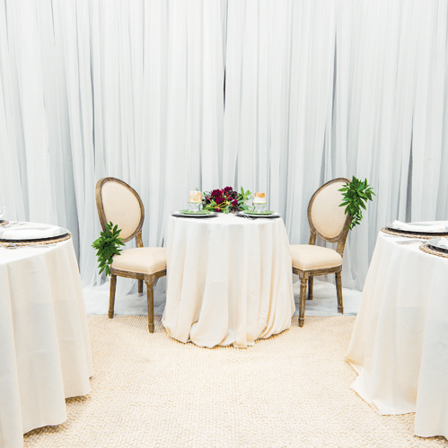 www-uptown-event-rentals-dot-com-34-sheer+ivory+linen+chair+decor+lg.png