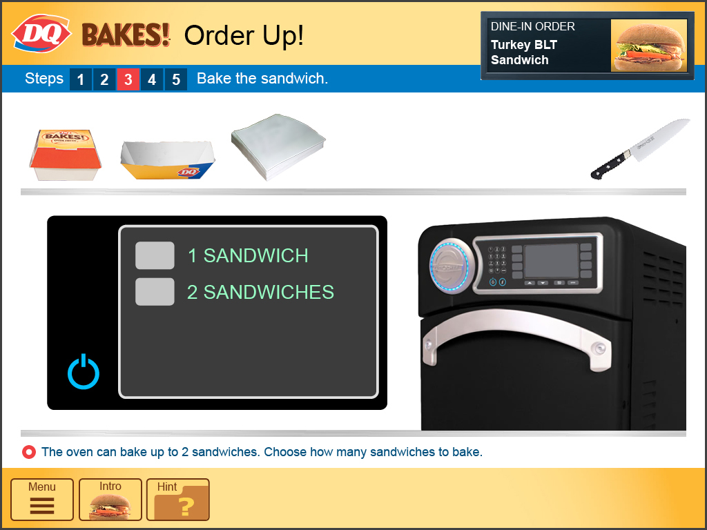  The oven is programmed for multiple products, including sandwiches. The employee presses the correct setting for one sandwich. 