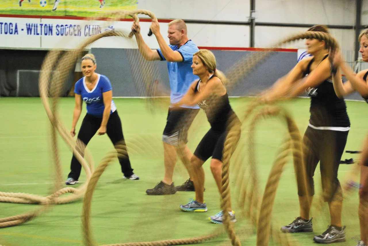Becky Weyrauch leads battling ropes at Rock Your Fitness.