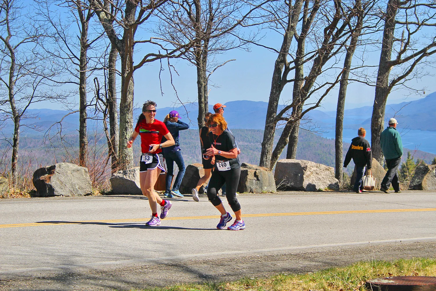 Finisher Christine Cifone-Clohosey cheers on Jill Pederson, race directors, at the 2016 Prospect Mountain Road Race. Brian Teague/Fateague Photography