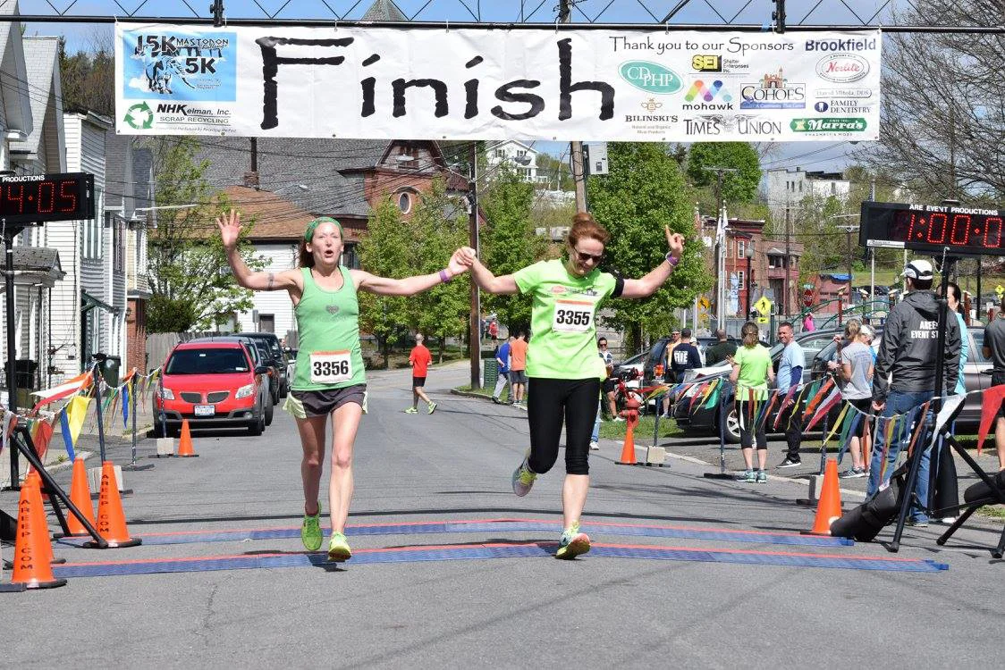 Finishers celebrating at the Mastodon Challenge 15K in Cohoes. Neil Sergott