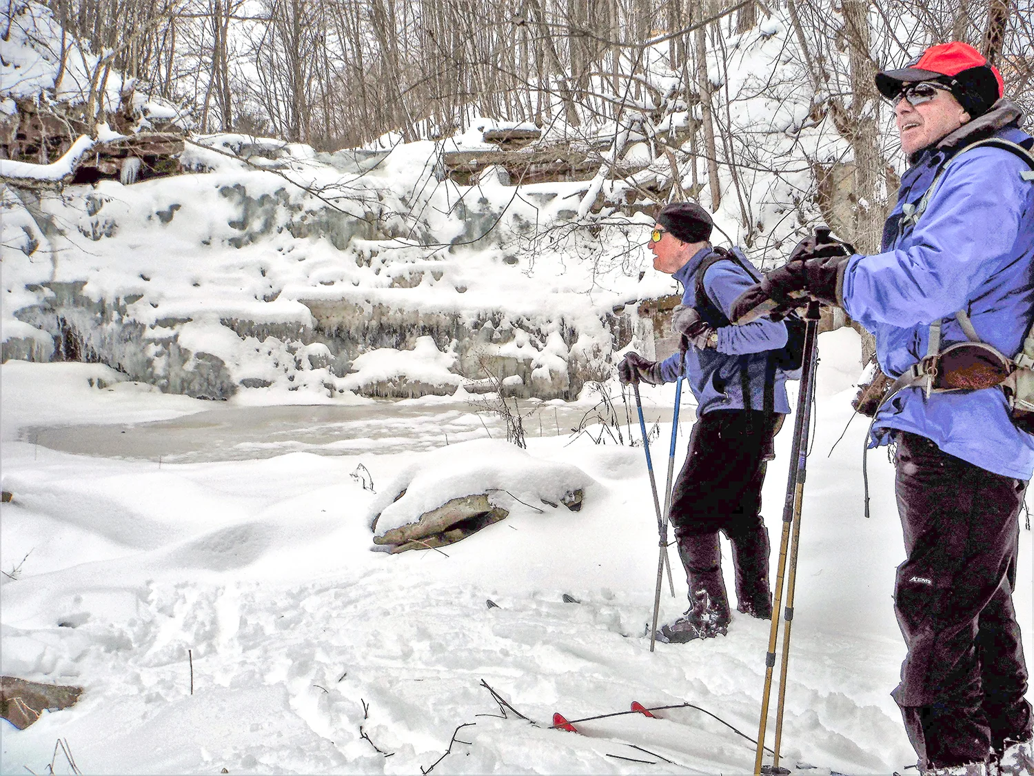 Skiers admire the falls at Wolf Creek Falls Preserve. Rich Macha