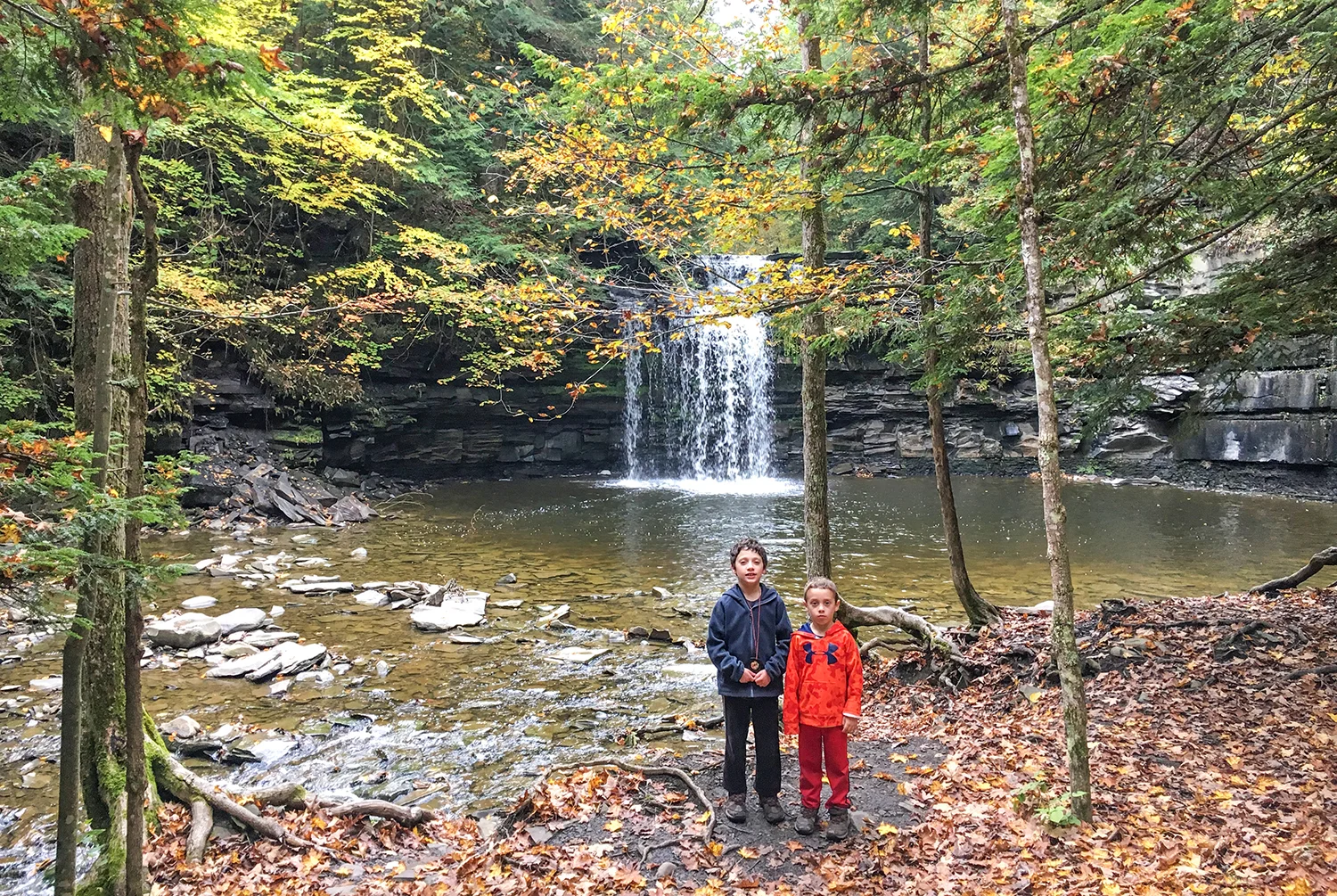 Conor and Theo enjoy exploring near the waterfall at Christman Sanctuary.