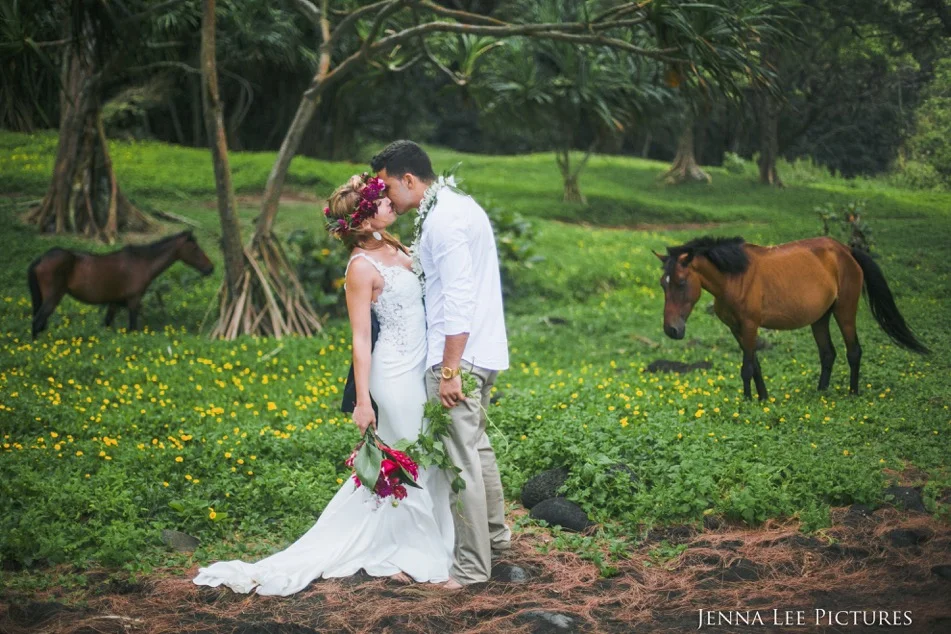 Lauren and Alex Michaels embrace each other on a black san beach in Waipio Valley in Hawaii on July 22. Tropical Storm Darby postponed their planned shoot on Kilauea, one of the most active volcanoes in the world.